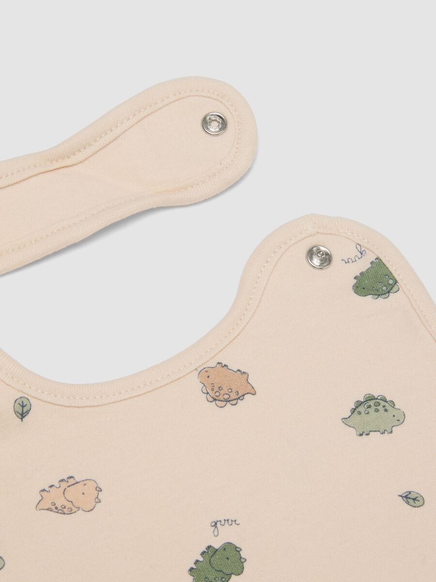 2-pack beige dinosaur print bibs in pure organic cotton_1