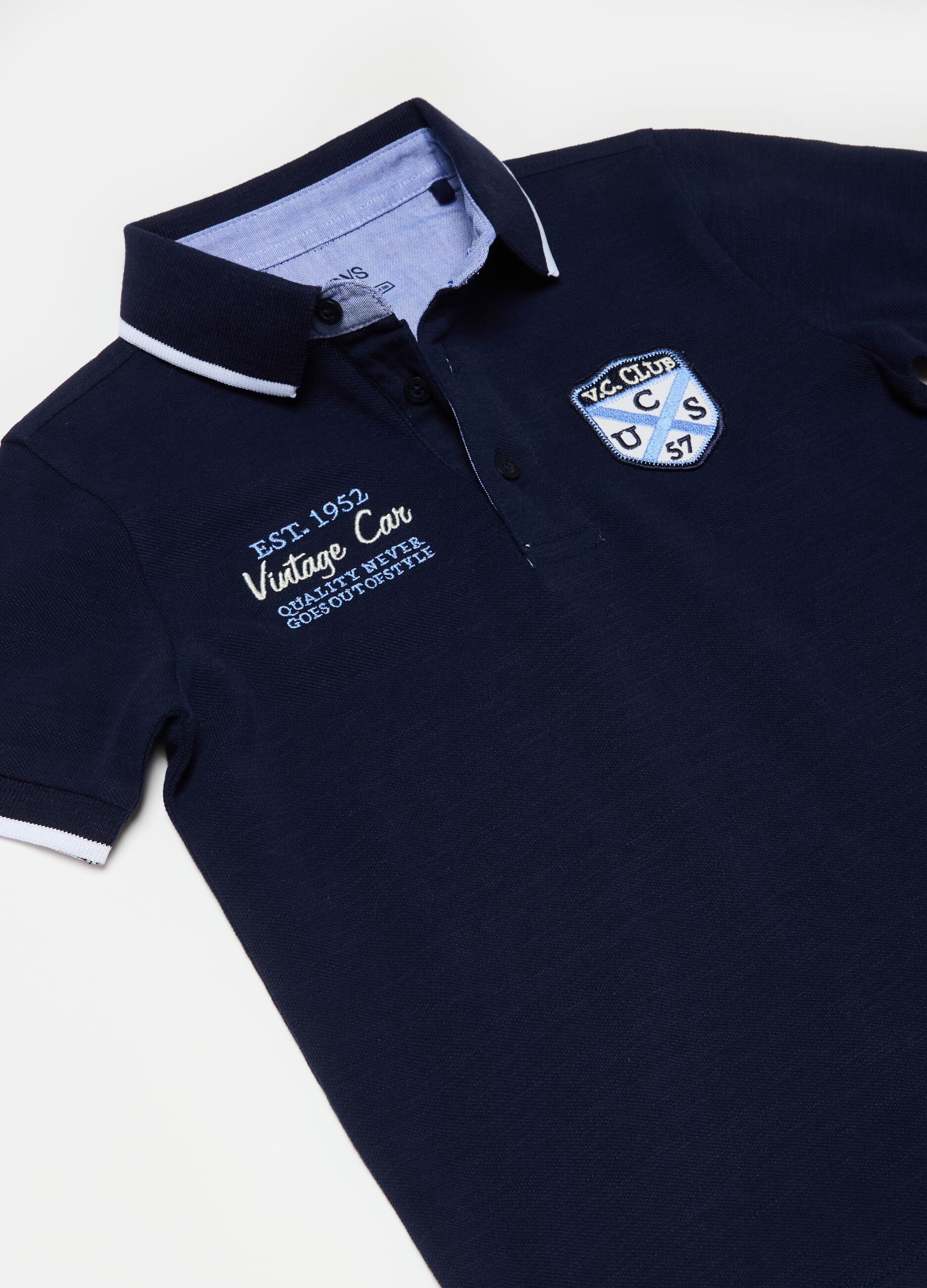 Polo shirt with striped edging and embroidery
