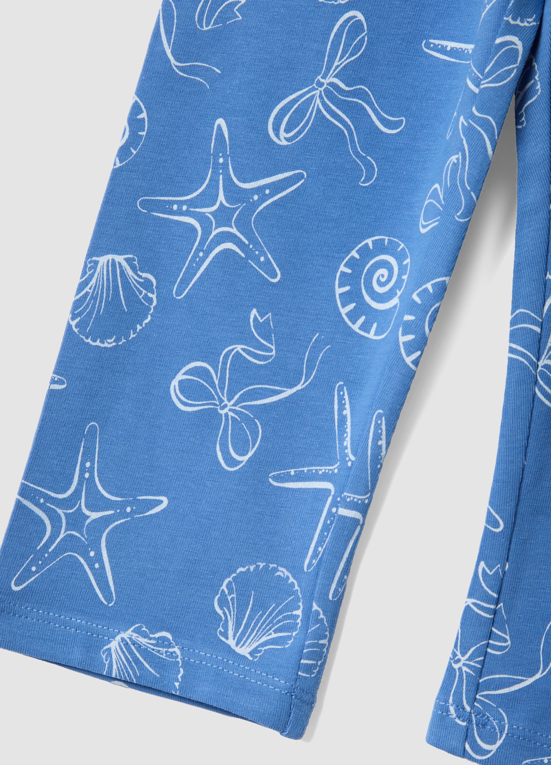 Girls&rsquo; skinny light blue stretch cotton leggings with prints