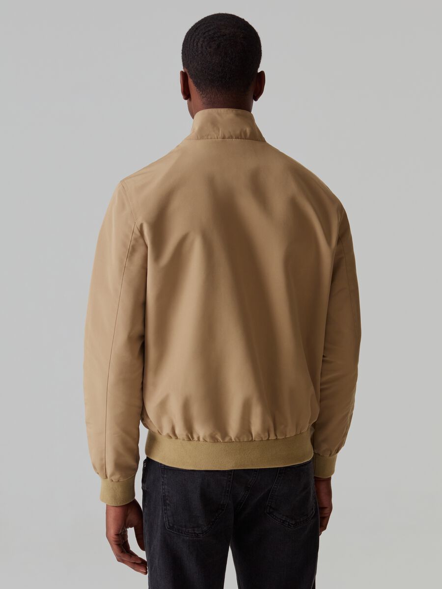 Full-zip bomber jacket with high neck and buttons_2