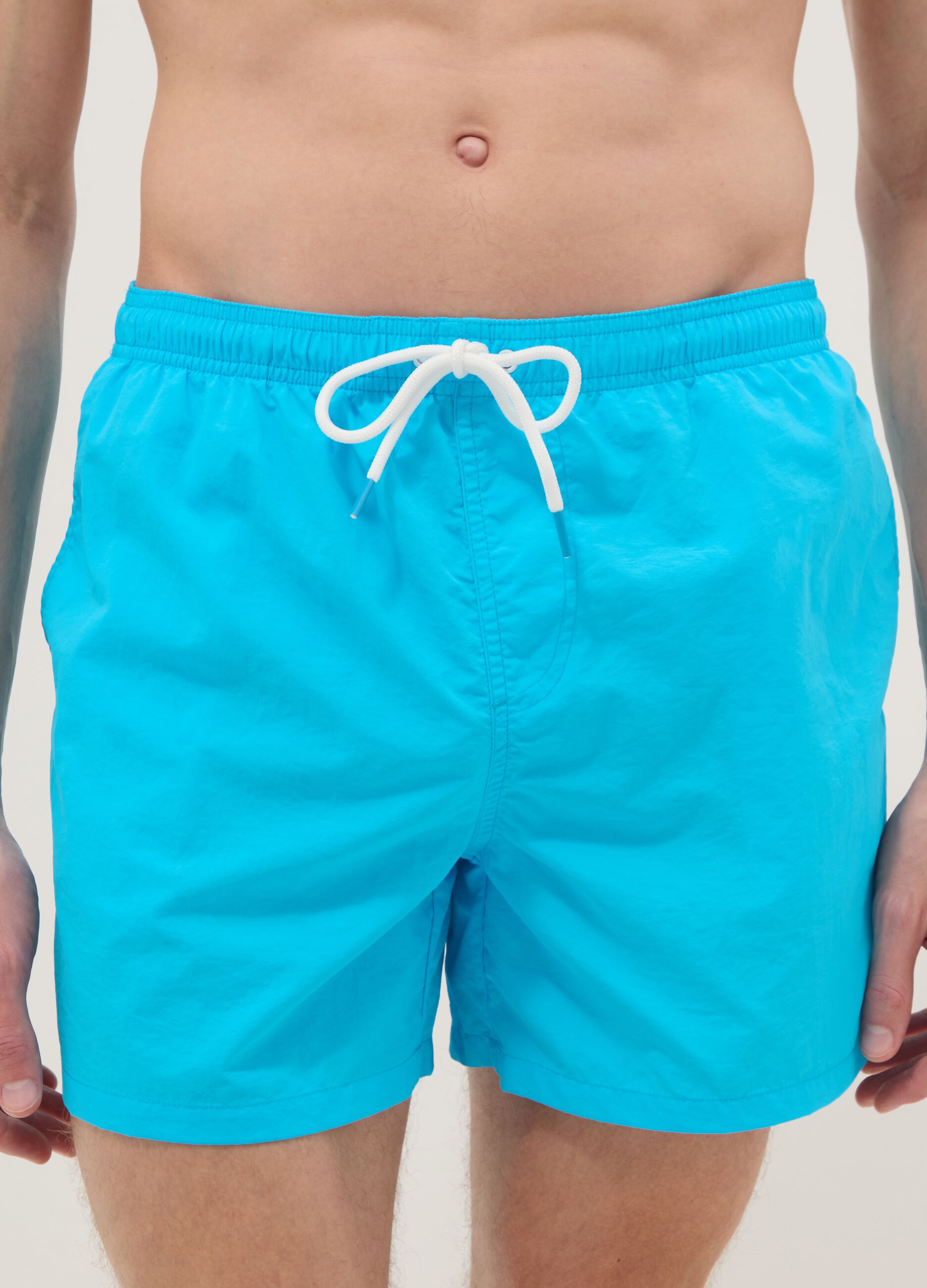 Blue swim shorts with elasticated waist