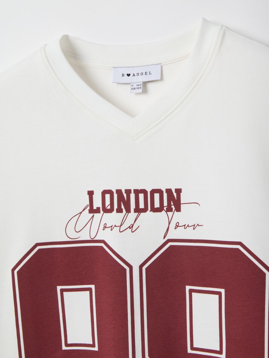 Oversized white pure cotton T-shirt with print and V-neck_1