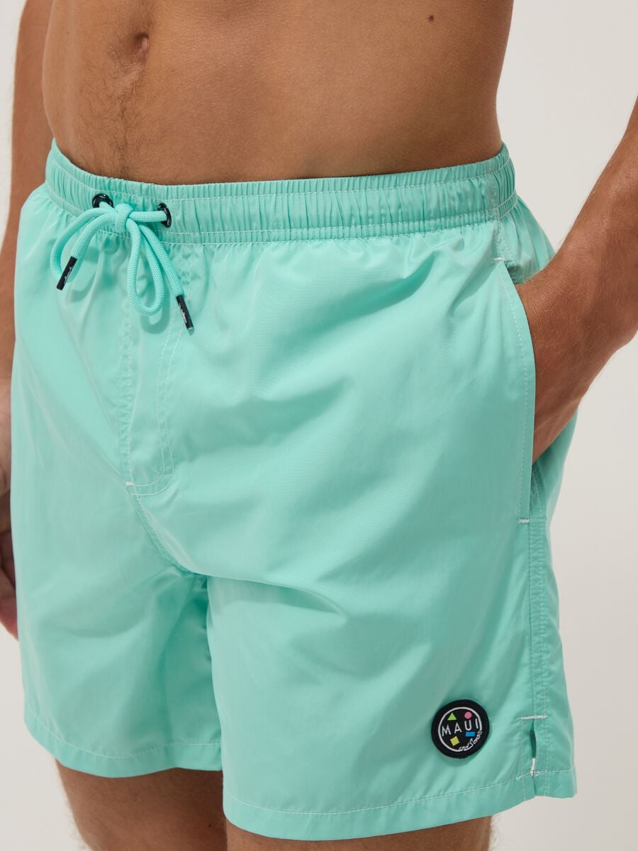 Ba&ntilde;ador azul claro con cord&oacute;n en la cintura_3