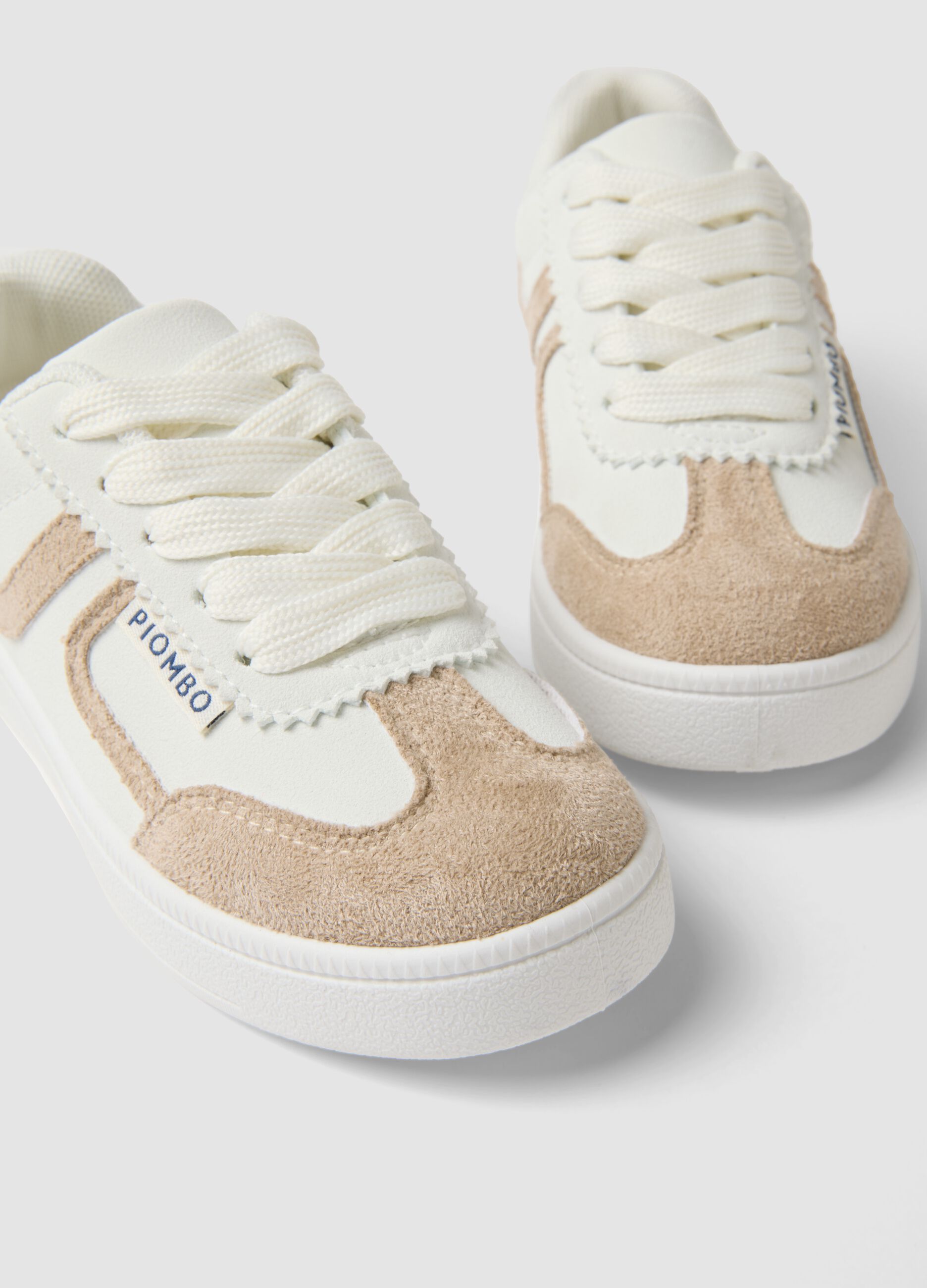 White and beige children's sneakers