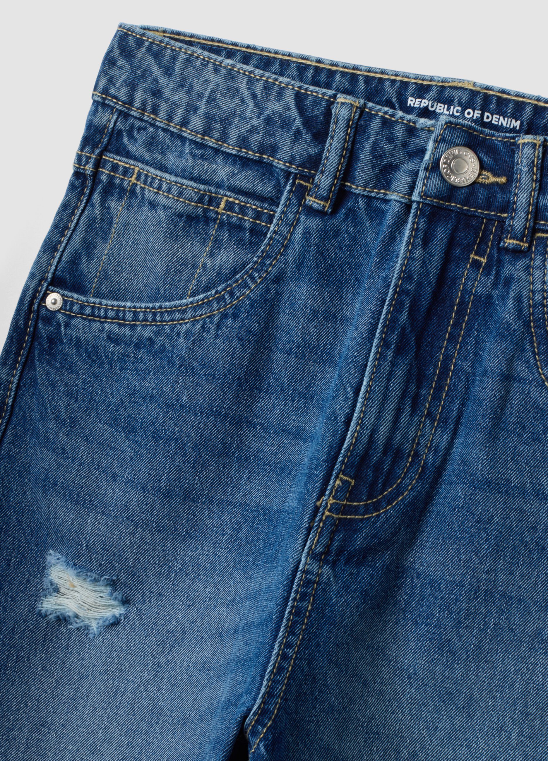 Jeans blu baggy in puro cotone con strappi per ragazzo