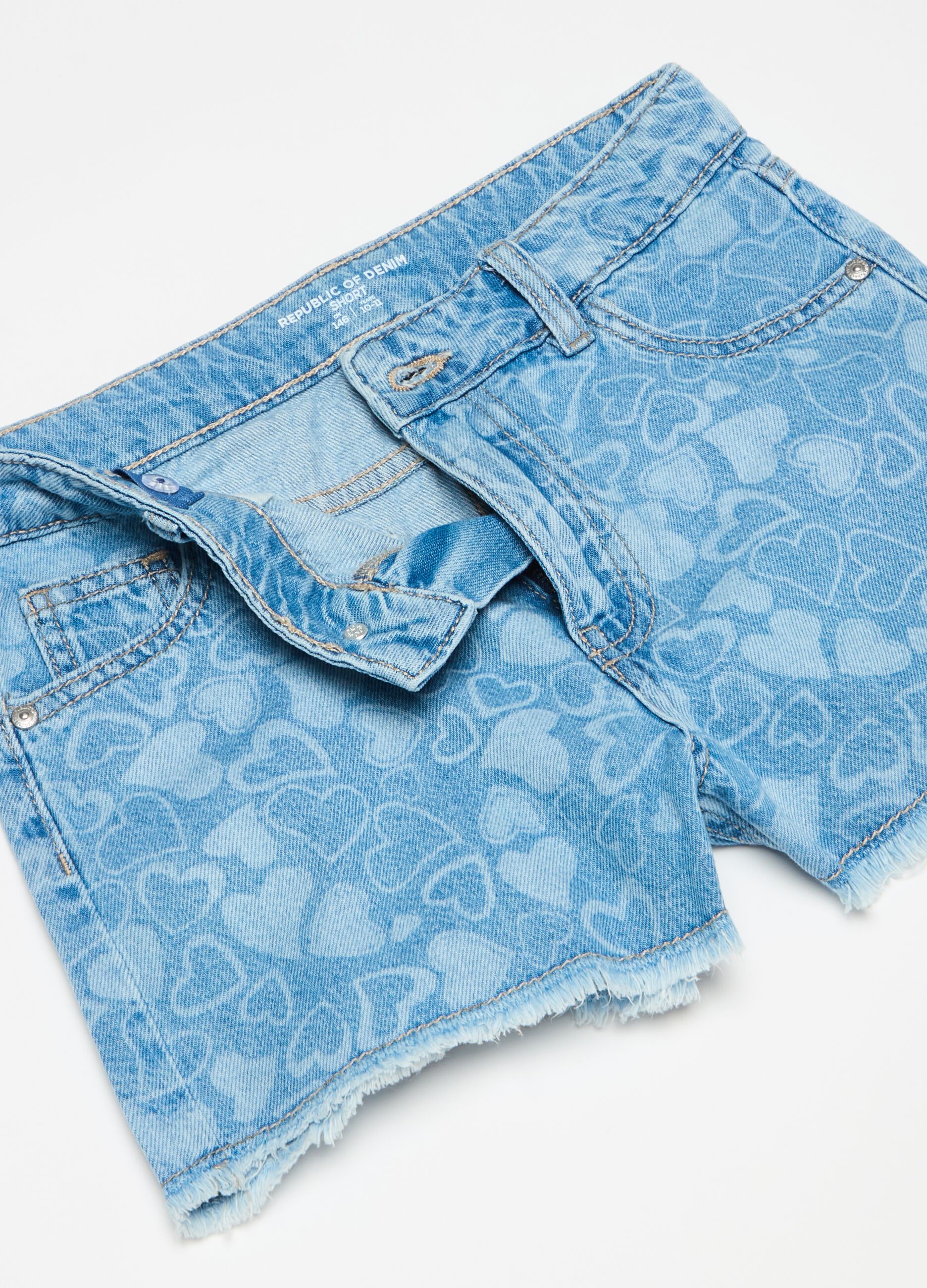 Denim shorts with all-over hearts print