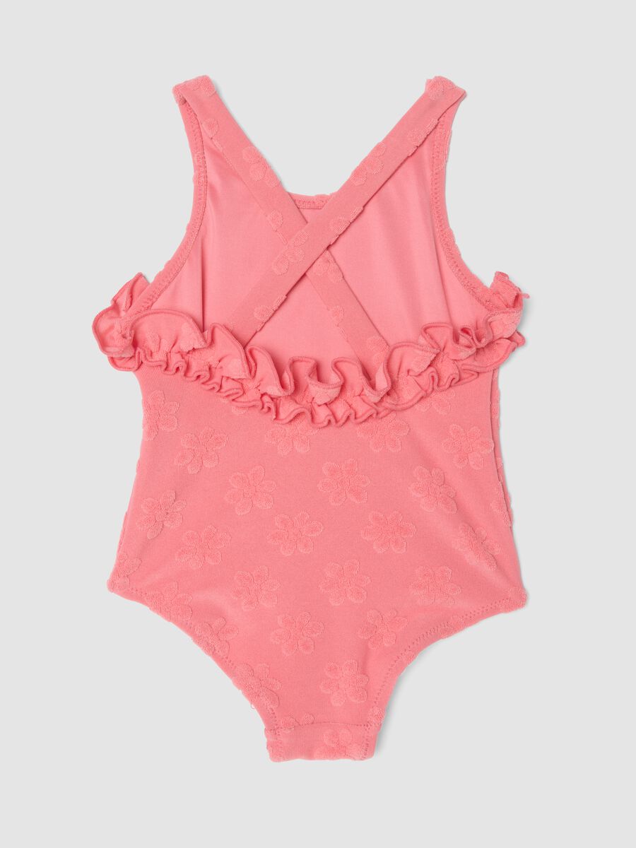 Pink stretch-fabric one-piece swimsuit for baby girls with floral detailing_1