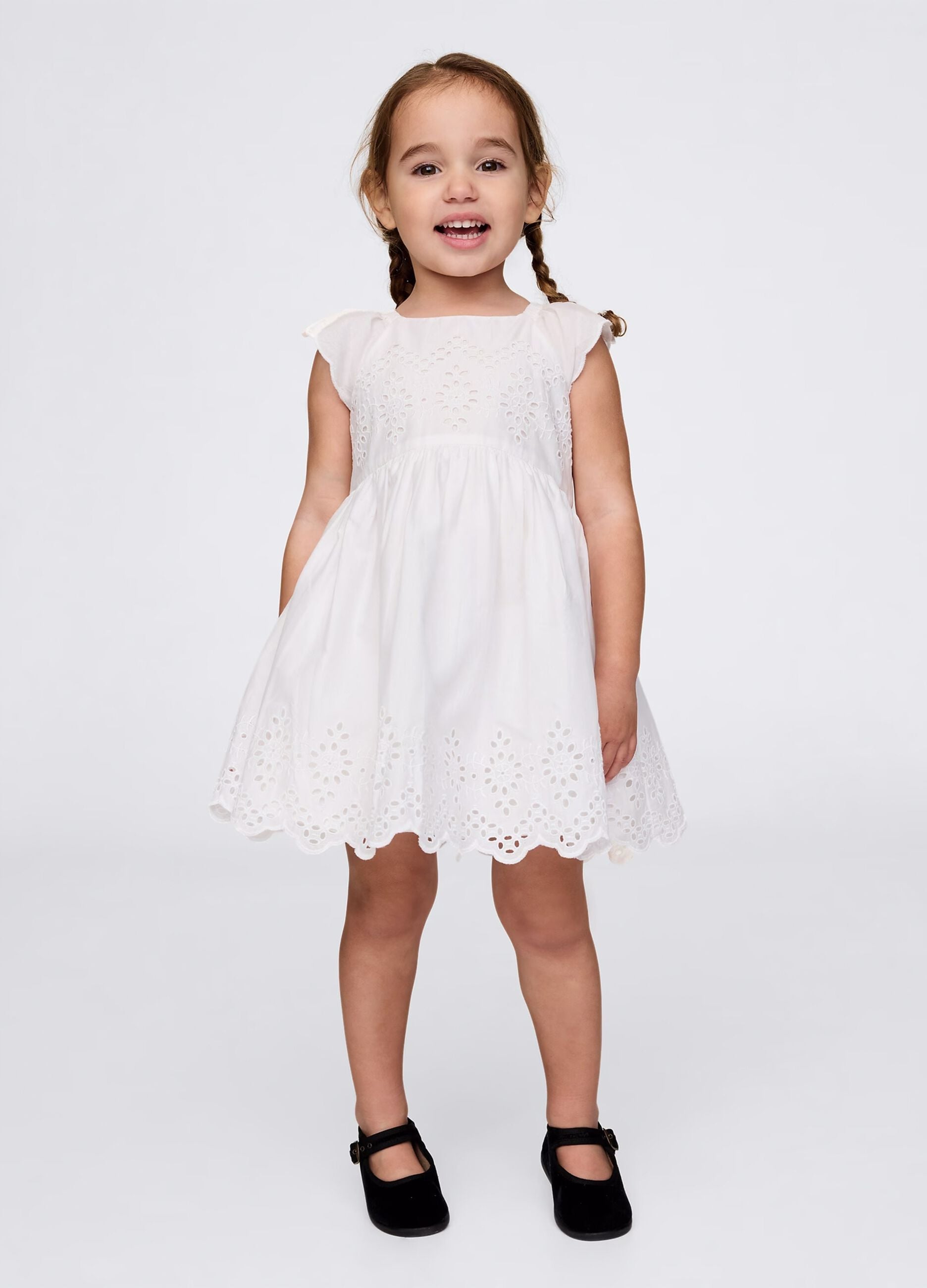 White dress in cotton with openwork flowers