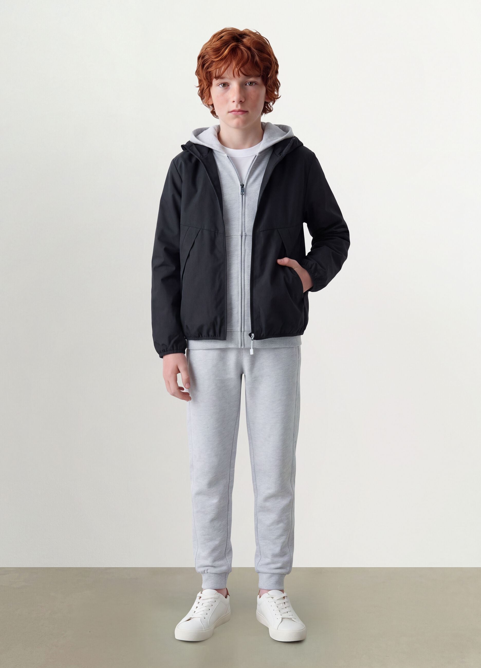 Black oversized rain jacket with hood and zip for boys
