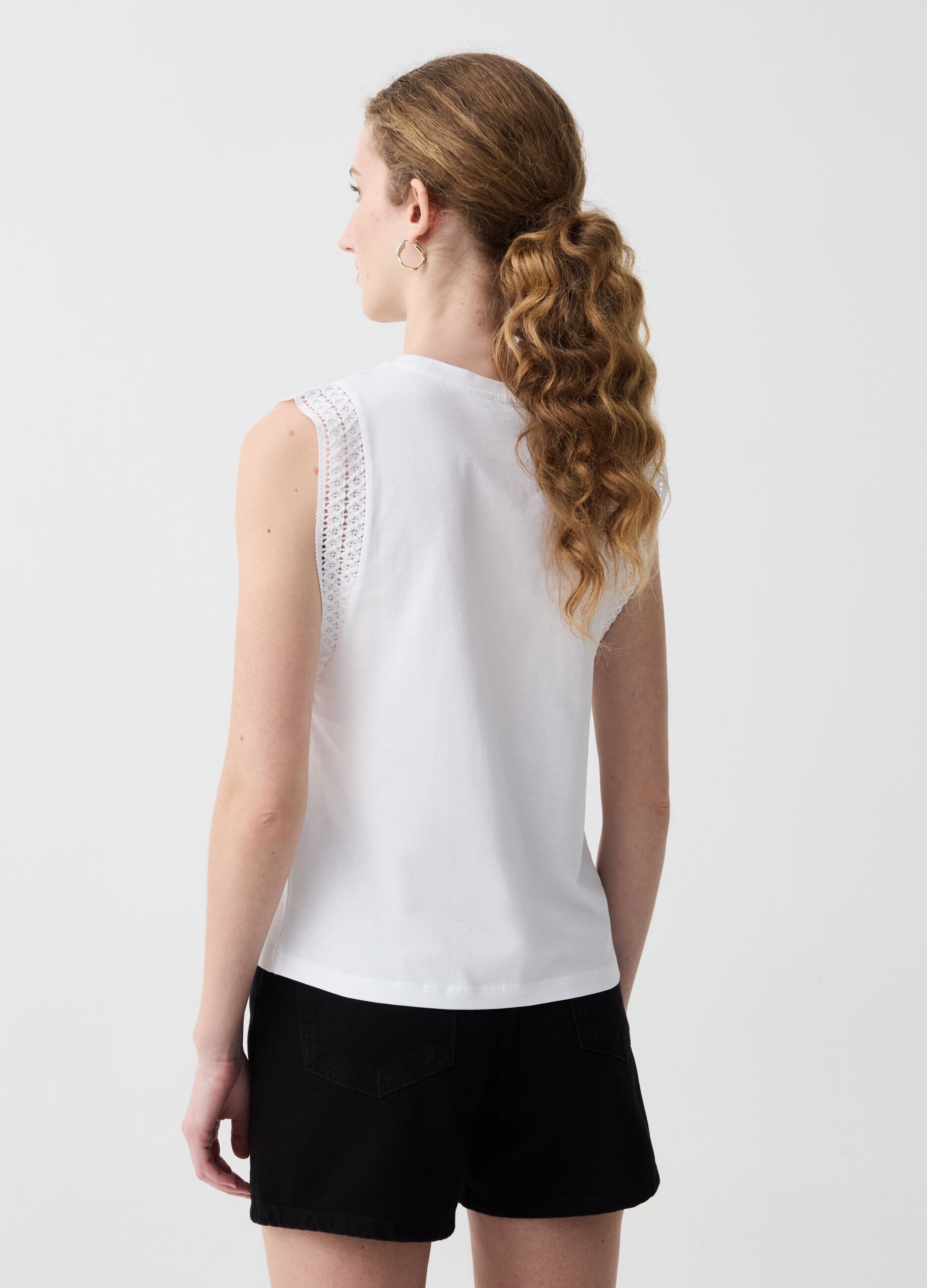 Sleeveless top with embroidered trims