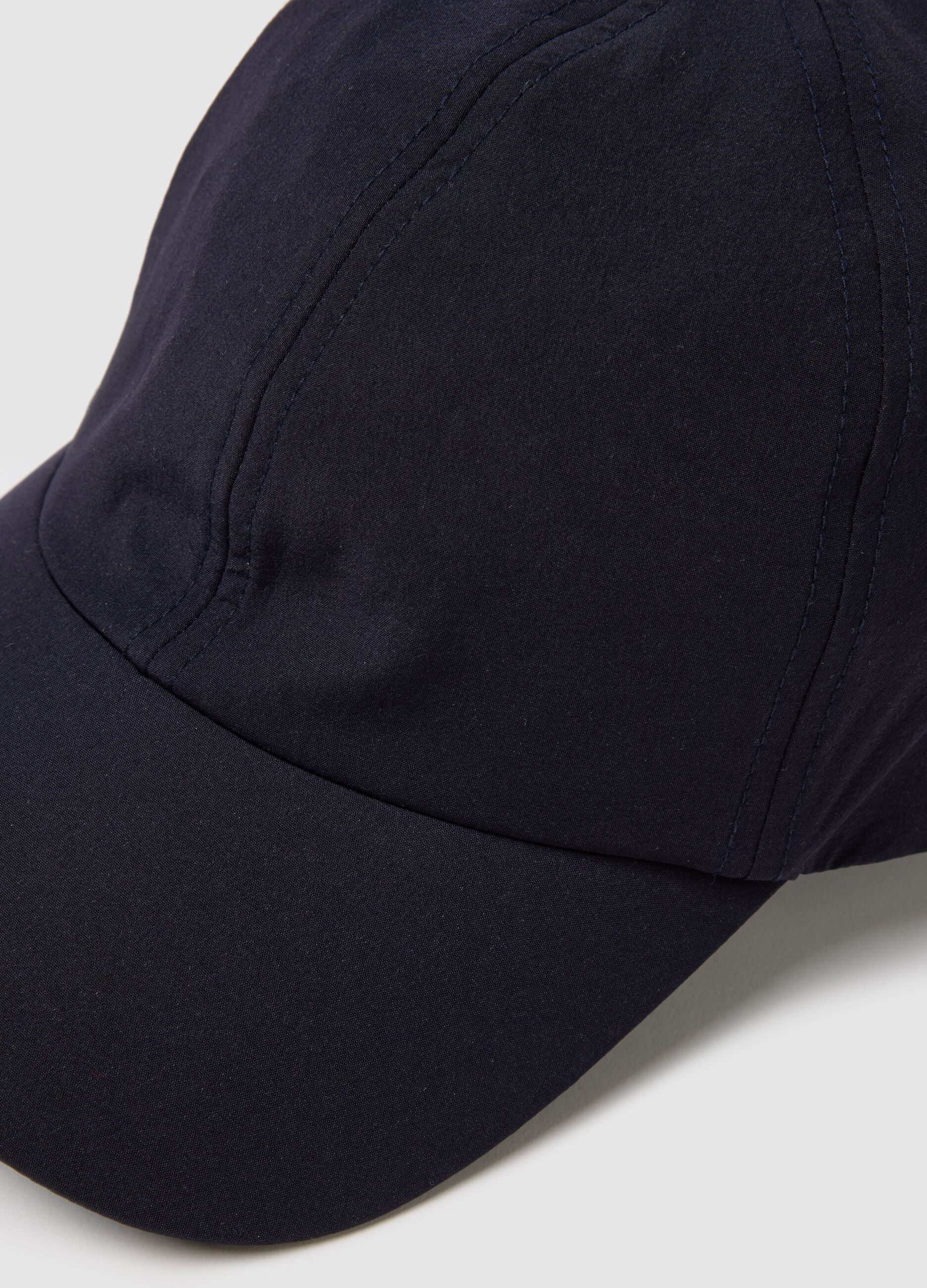 Blue cap with adjustable visor