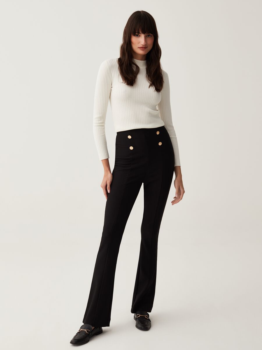 Flare-fit trousers with golden buttons_0