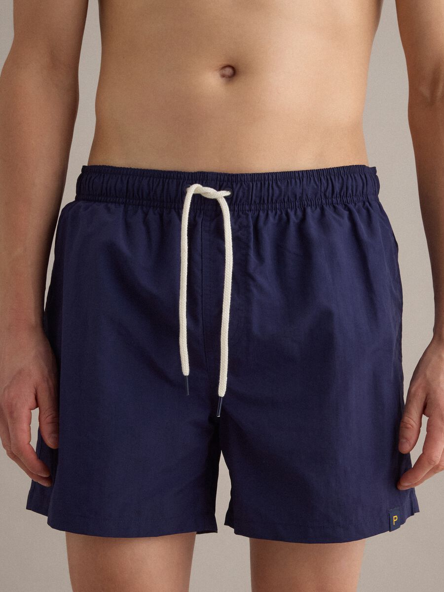 Blue swim shorts with elasticated waistband and drawstring_2