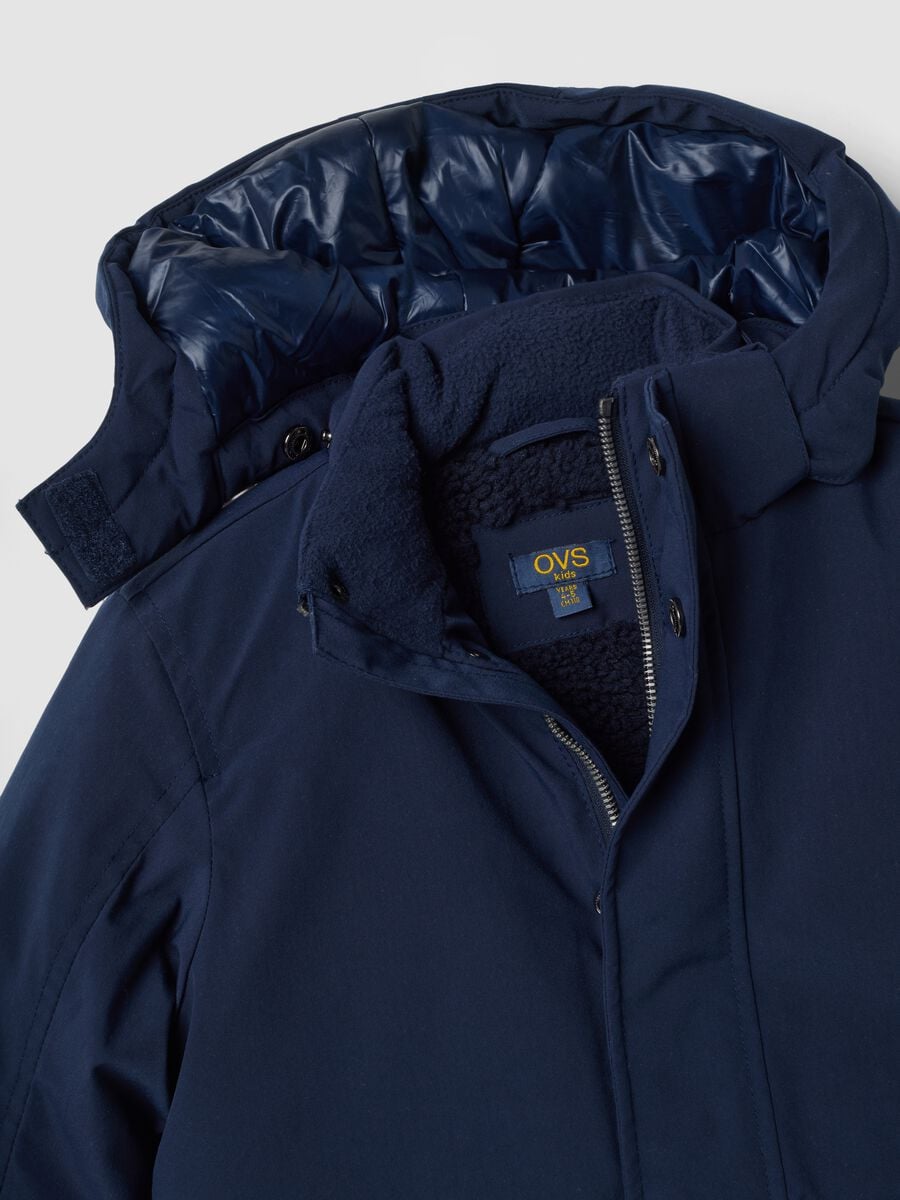 Long padded navy parka with detachable hood, oversized fit_2