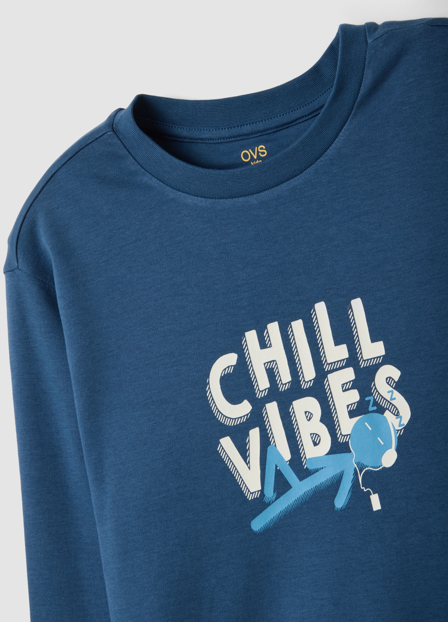 Blue organic cotton pyjamas with "Chill Vibes" slogan for boys