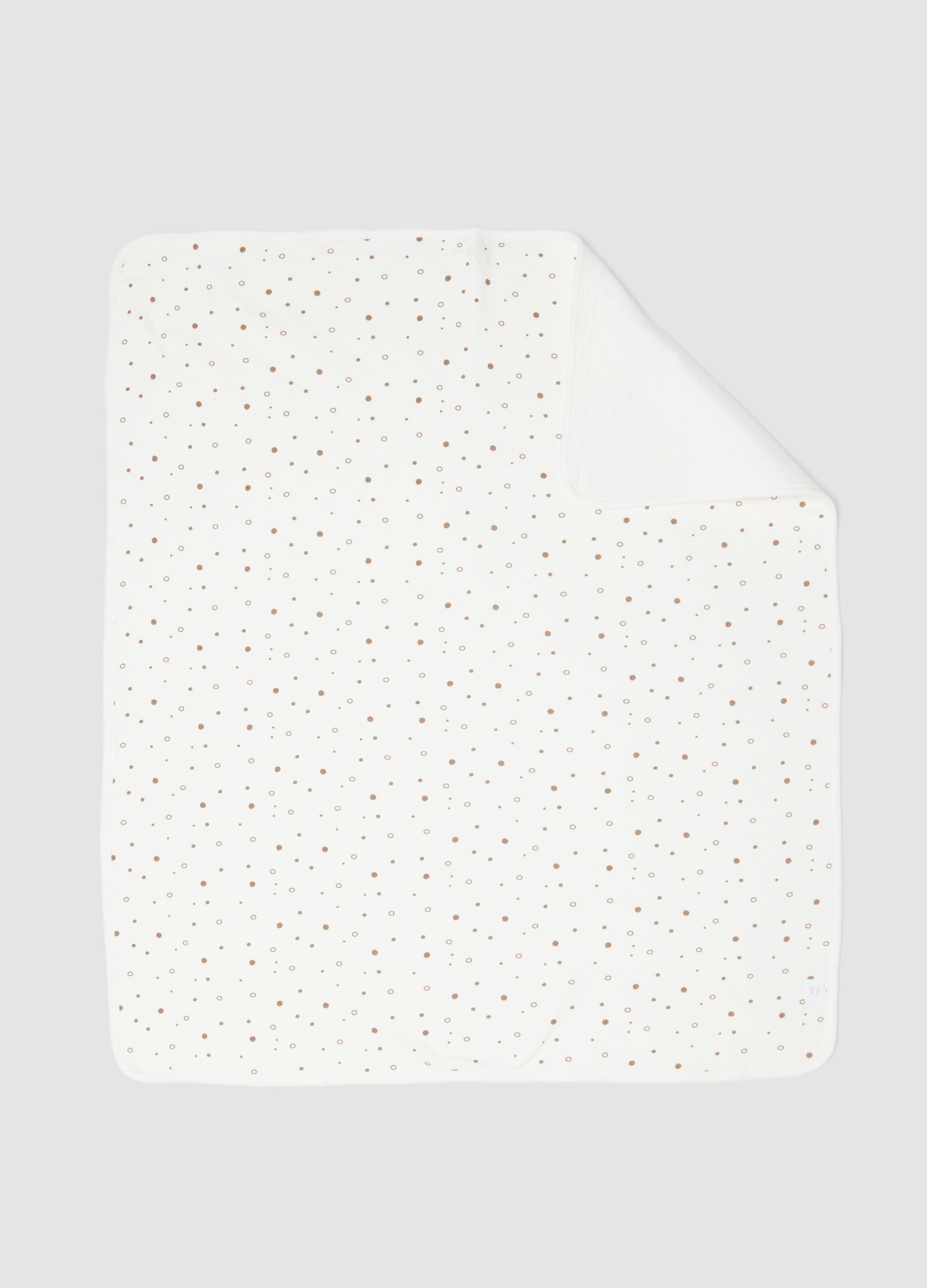 White organic cotton blend baby blanket with polka dots