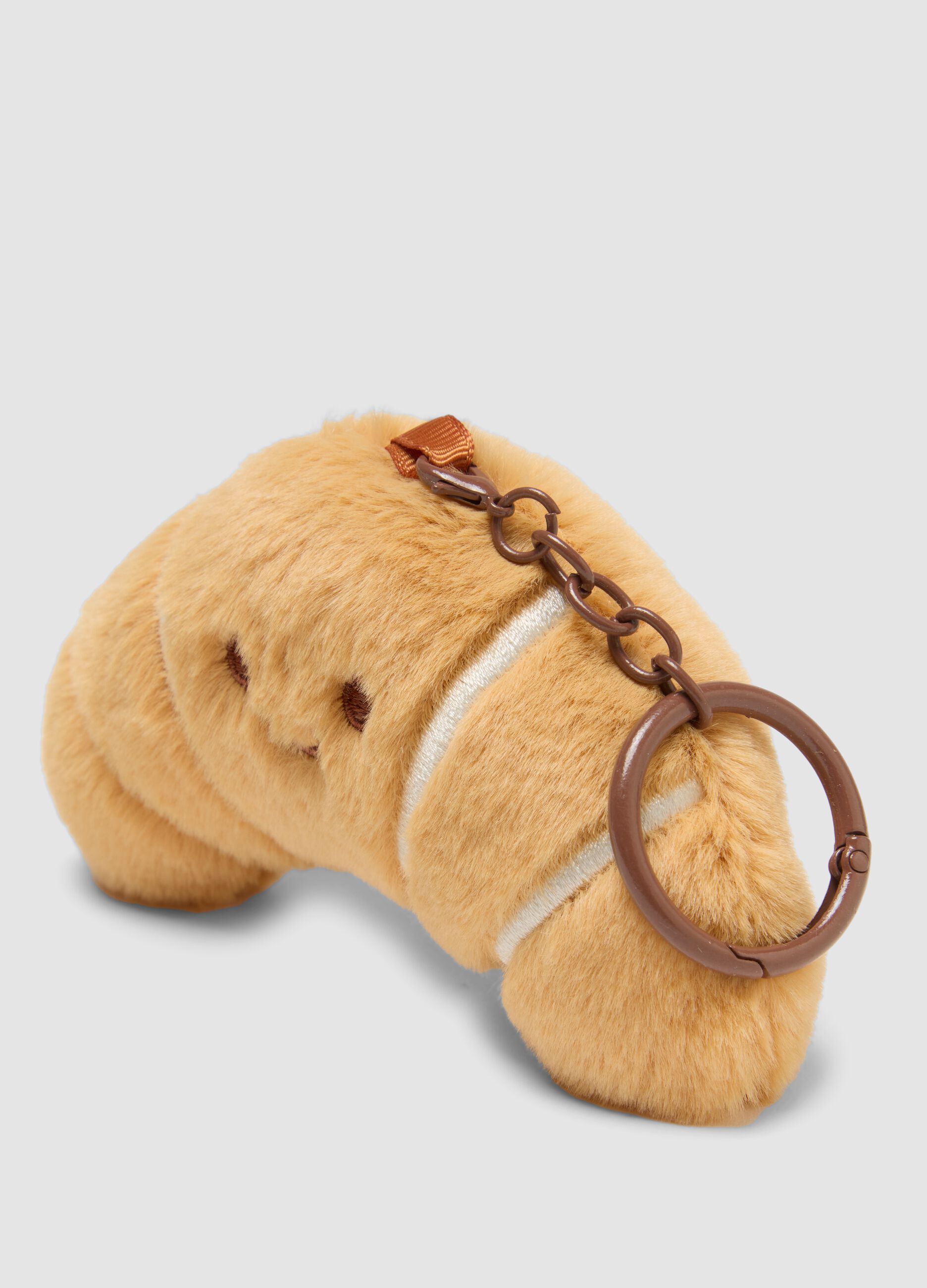 Brown croissant-shaped keyring