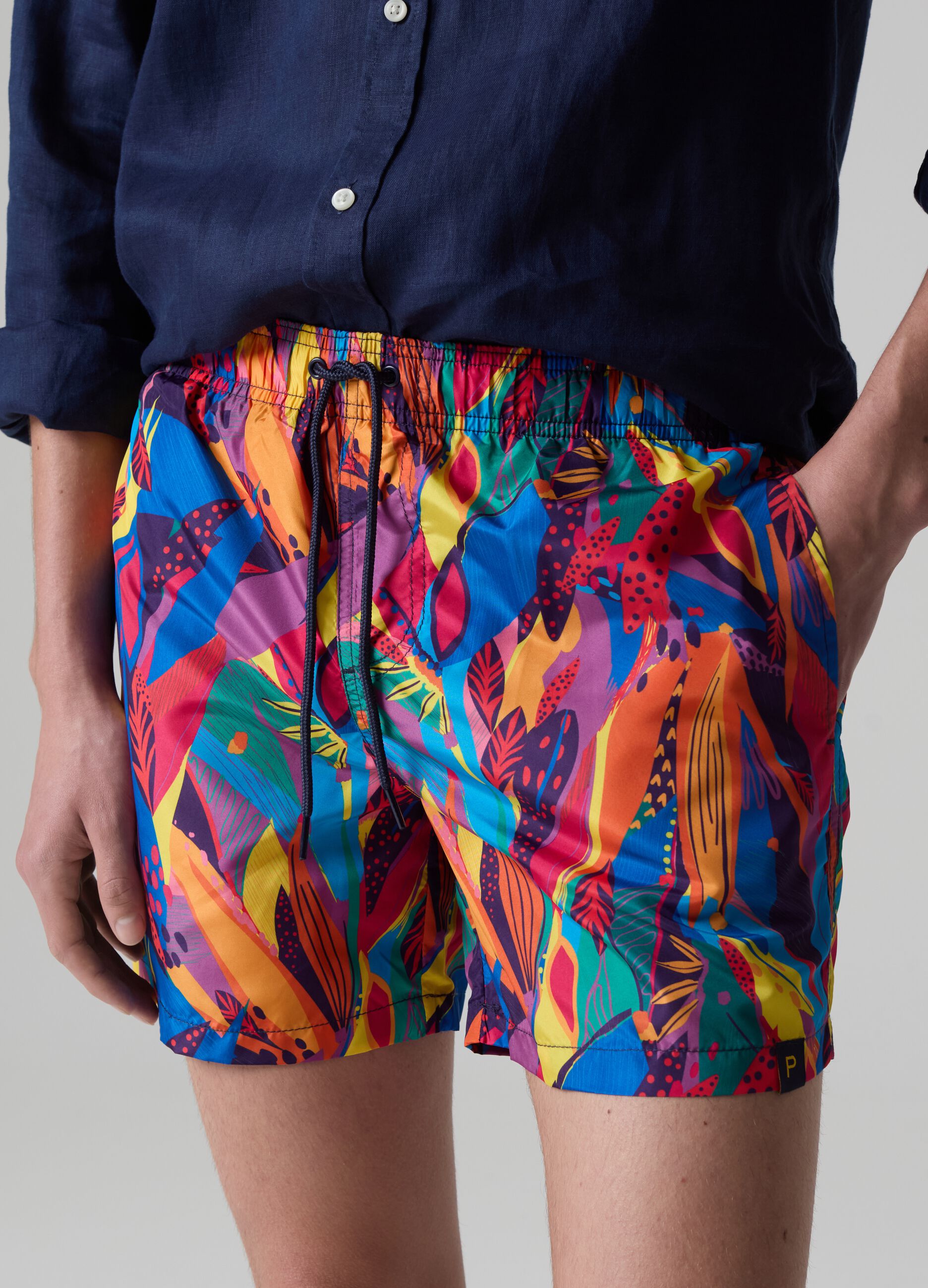 Bermuda swim shorts with tropical print