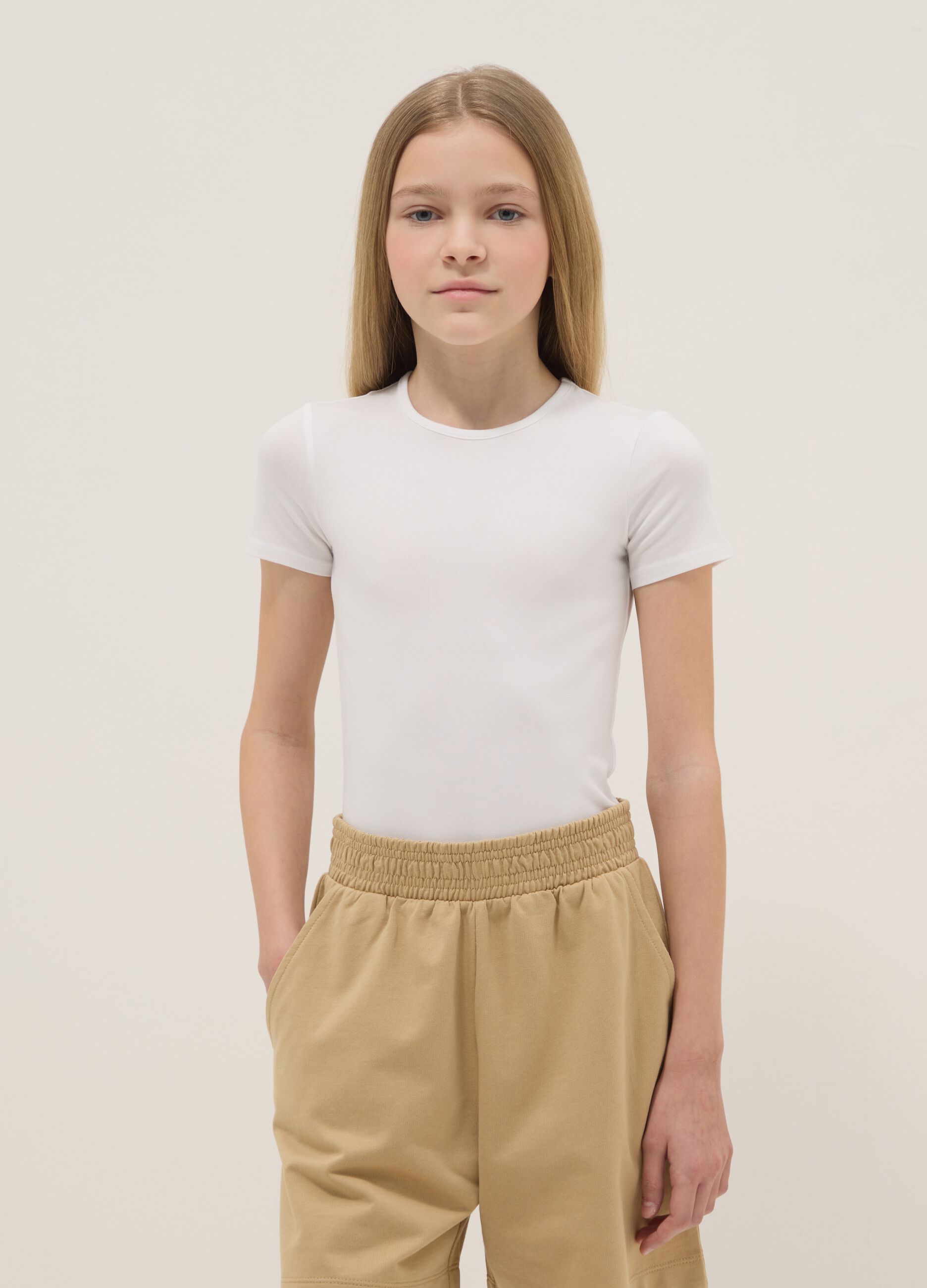 Girl's fitted white stretch cotton bodysuit