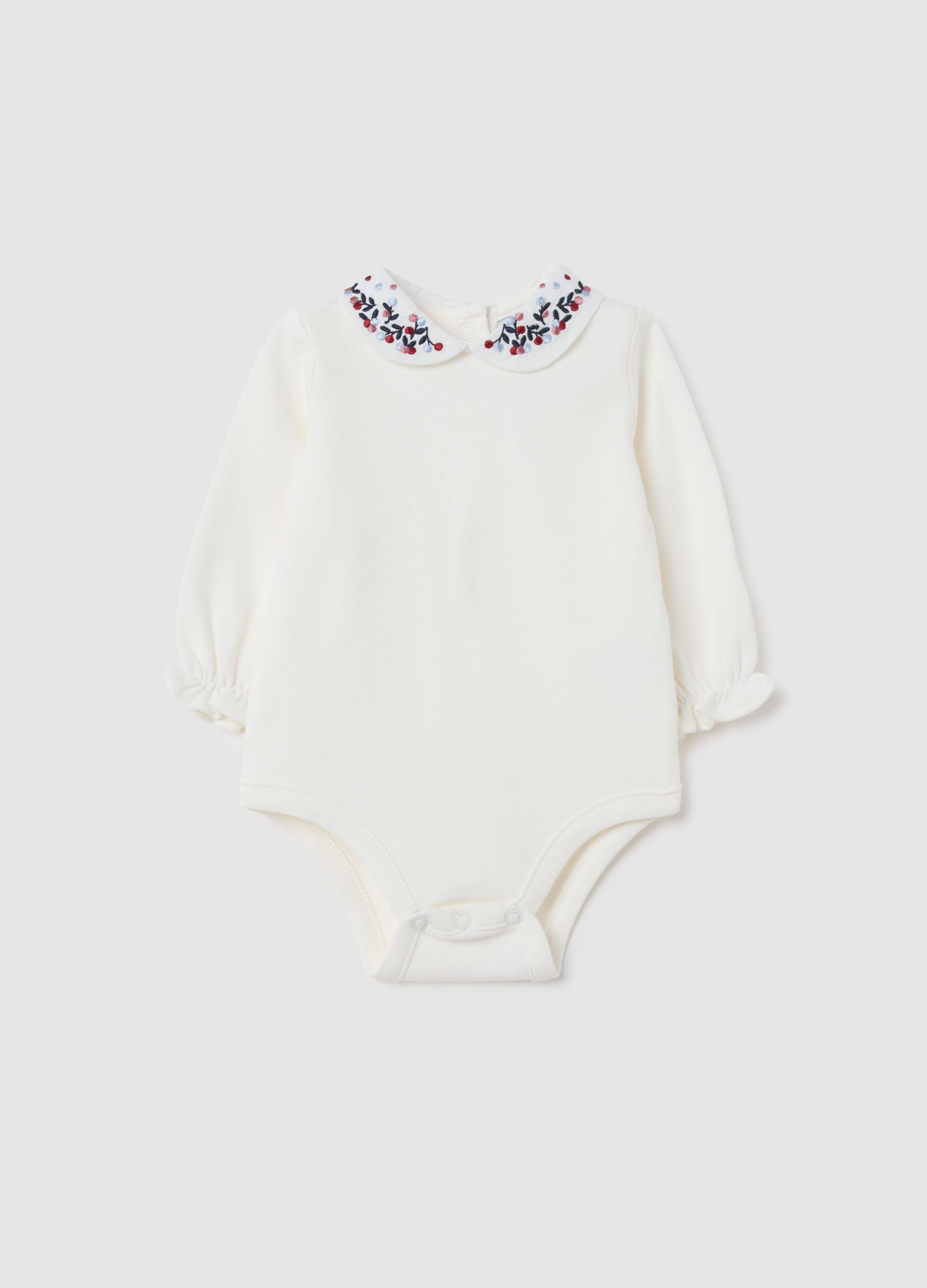 Newborn baby bodysuit in pure white cotton with ruffled collar