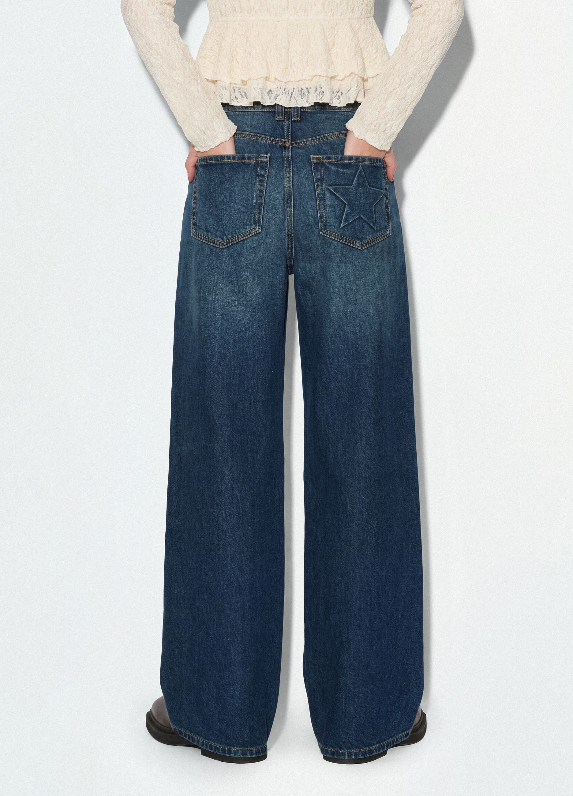 Blue denim jeans in 100% cotton with super wide-leg fit