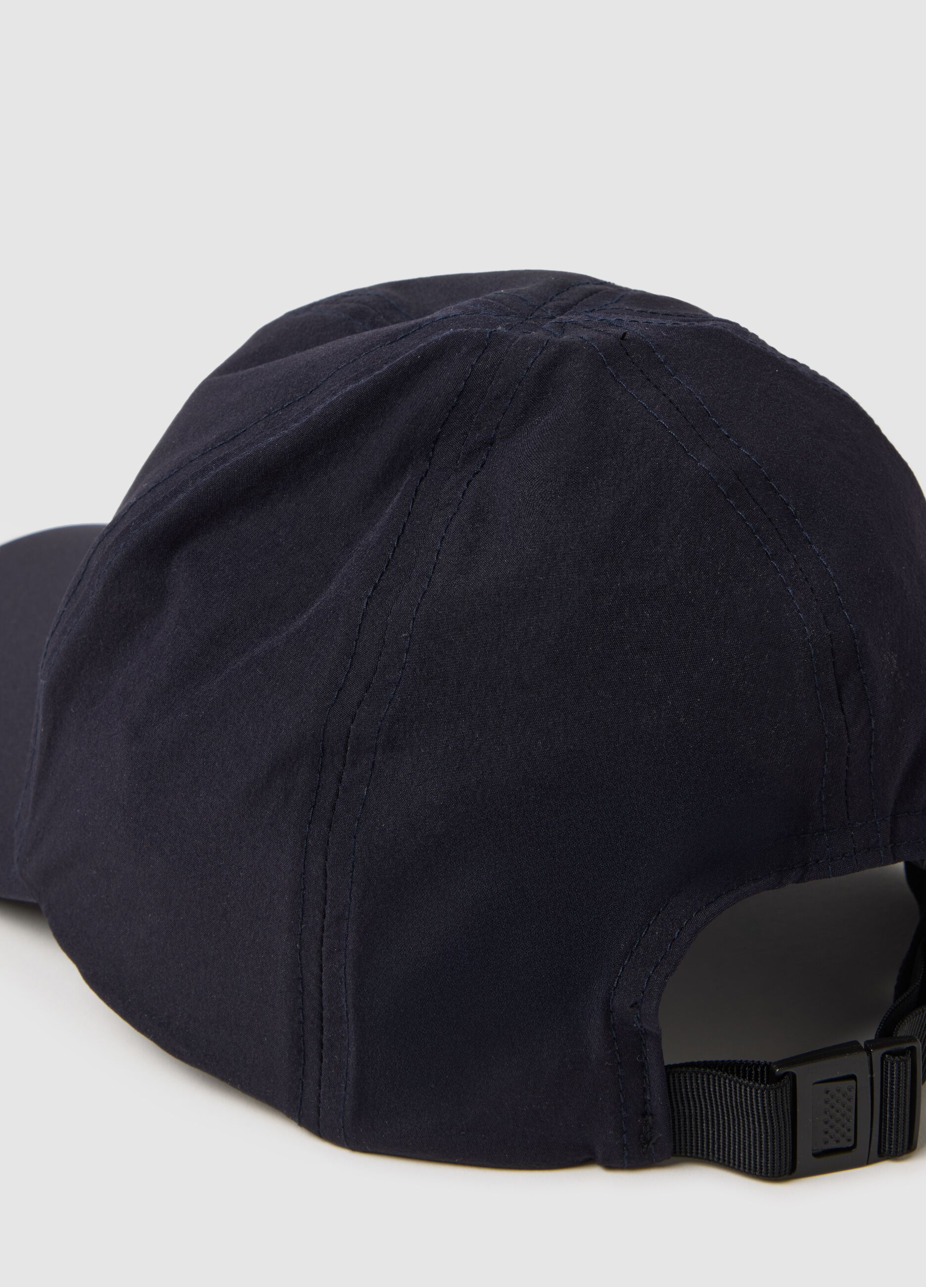 Blue cap with adjustable visor