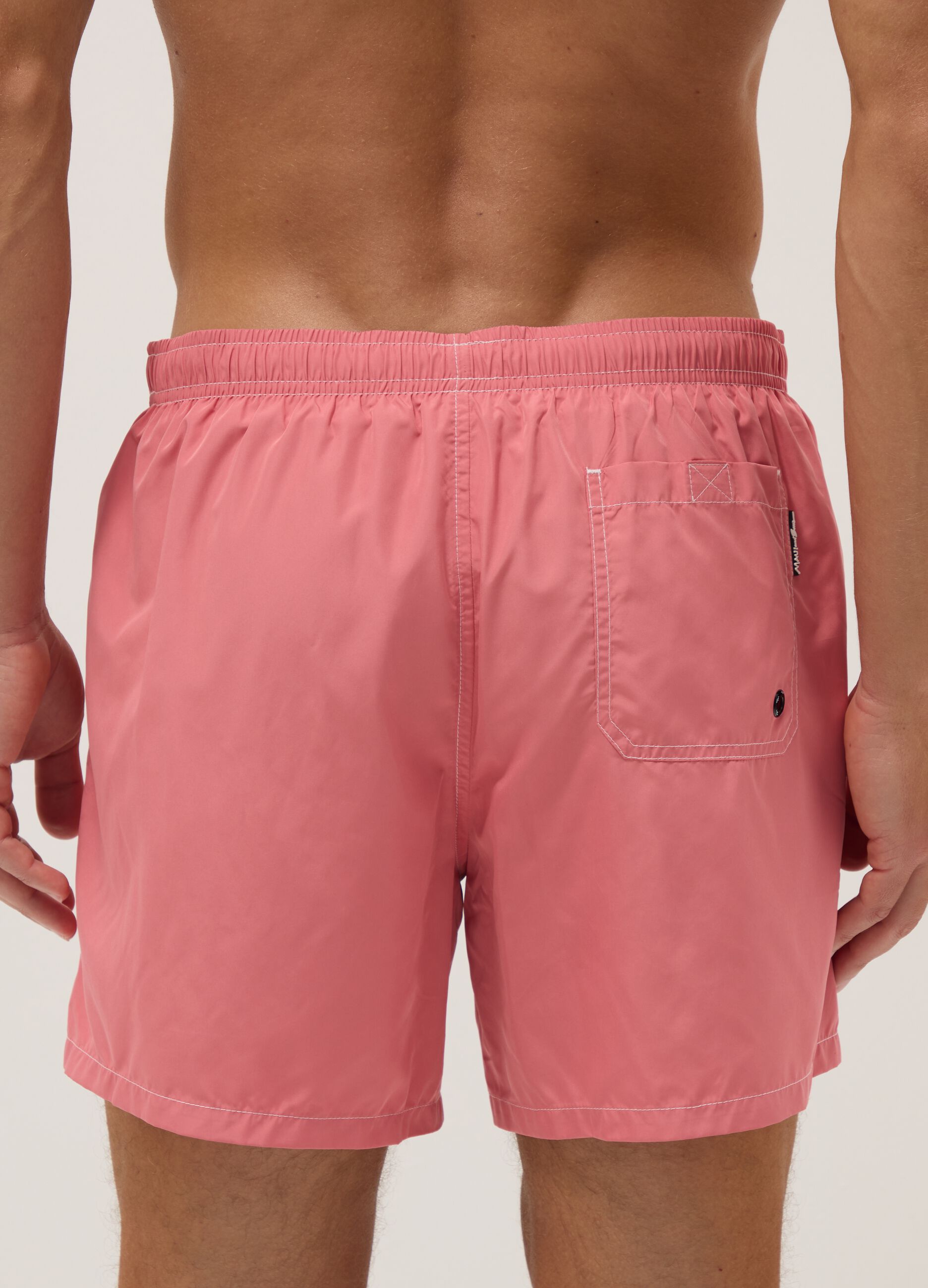 Pink swim shorts with elasticated waist