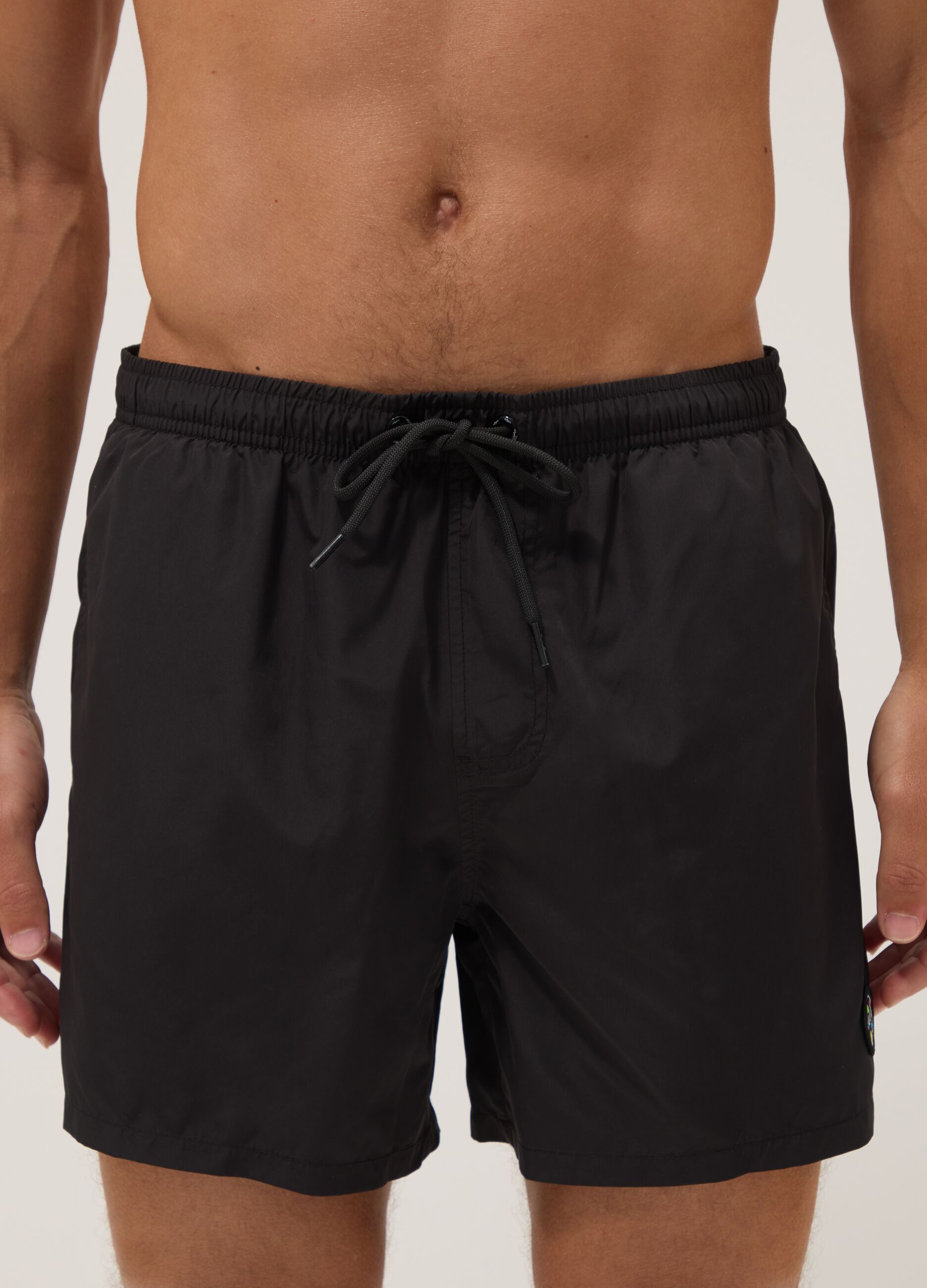 Black swim shorts with elasticated waistband
