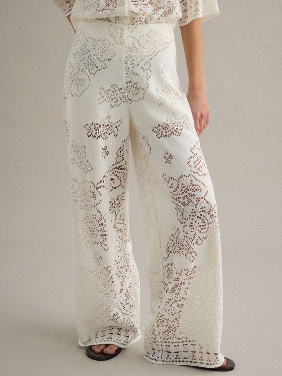 White wide leg cotton blend trousers with perforated texture_4