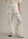 White wide leg cotton blend trousers with perforated texture_4