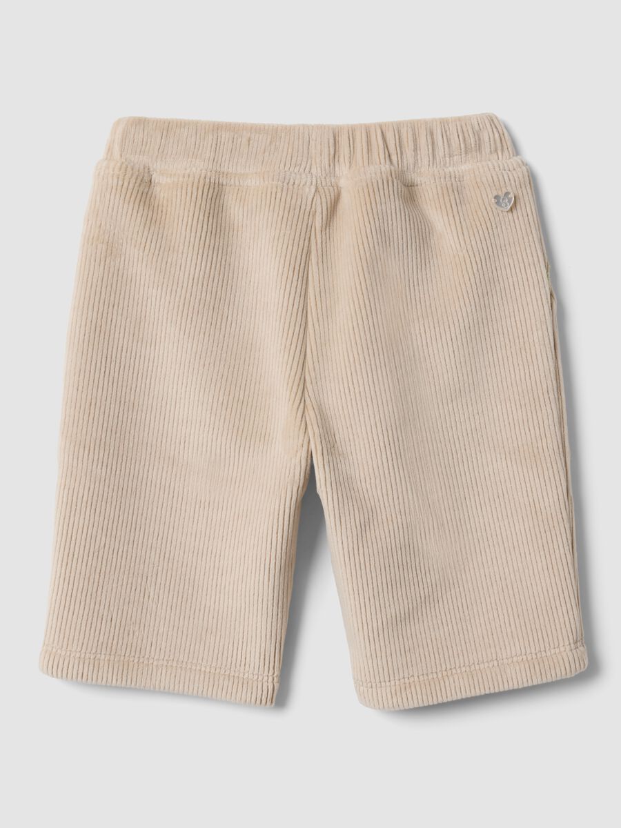 Pantaloni beige in tessuto elasticizzato a coste per neonata_1