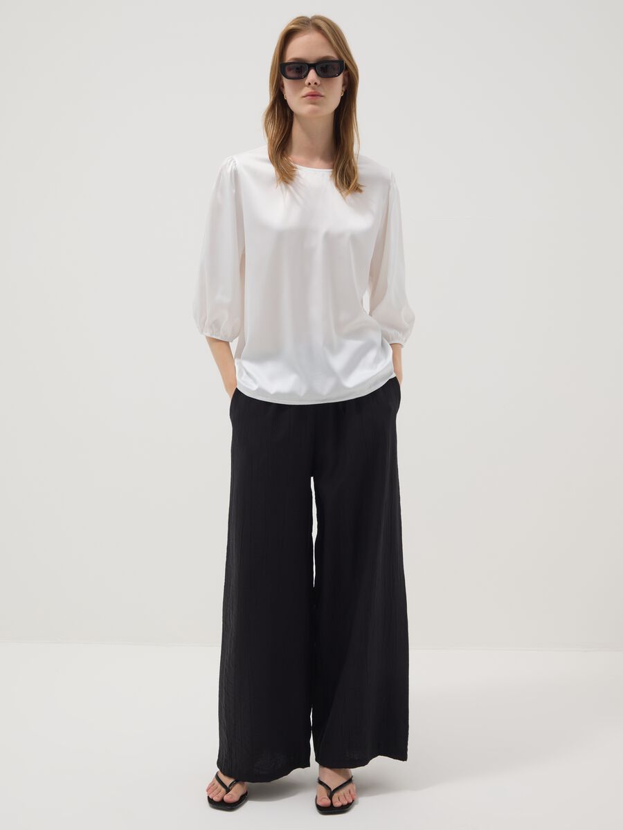 Black palazzo trousers in a viscose blend_0