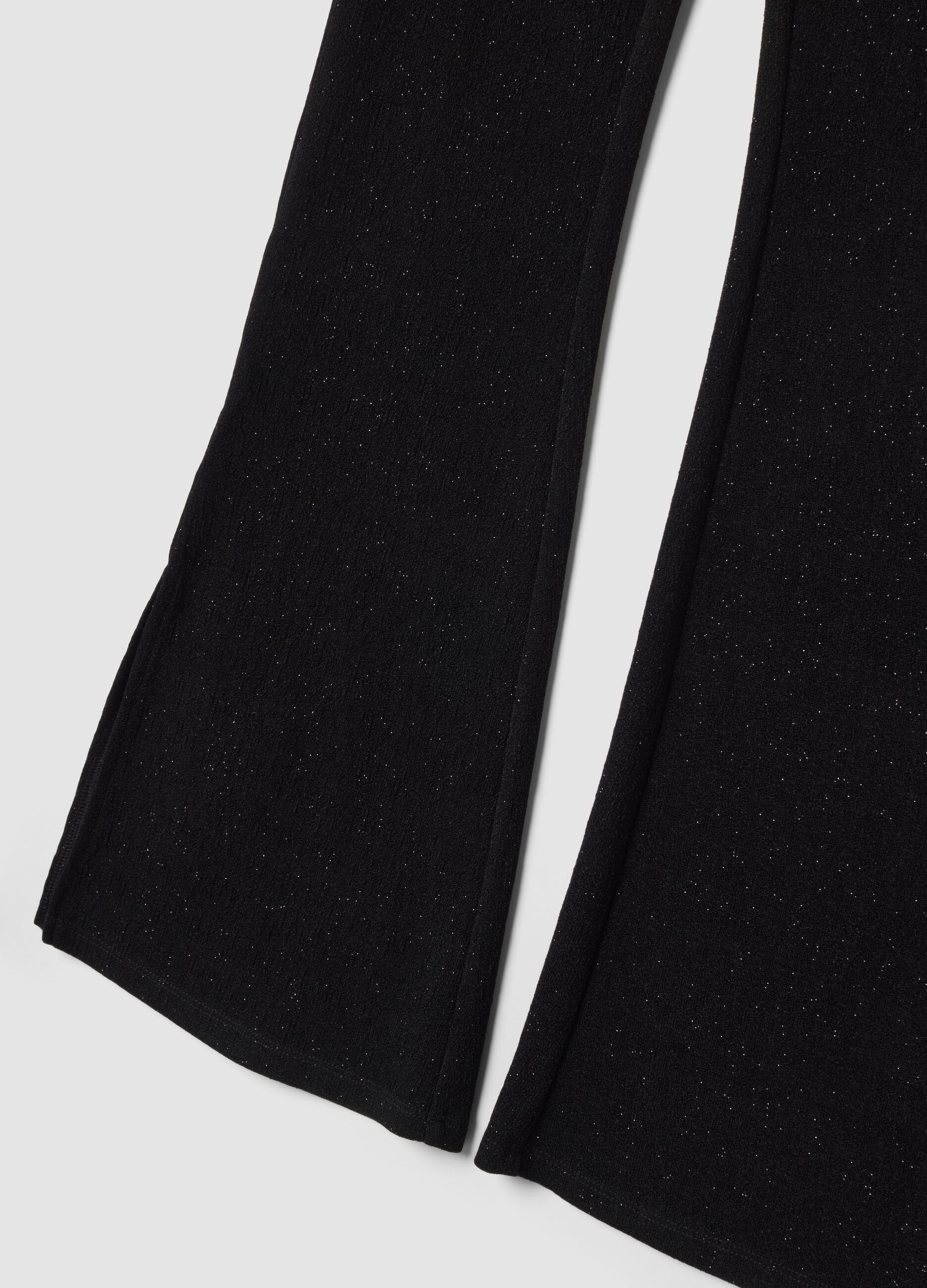 Pantaloni neri in tessuto elasticizzato a zampa slim fit con glitter