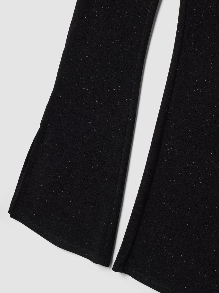Pantaloni neri in tessuto elasticizzato a zampa slim fit con glitter_1