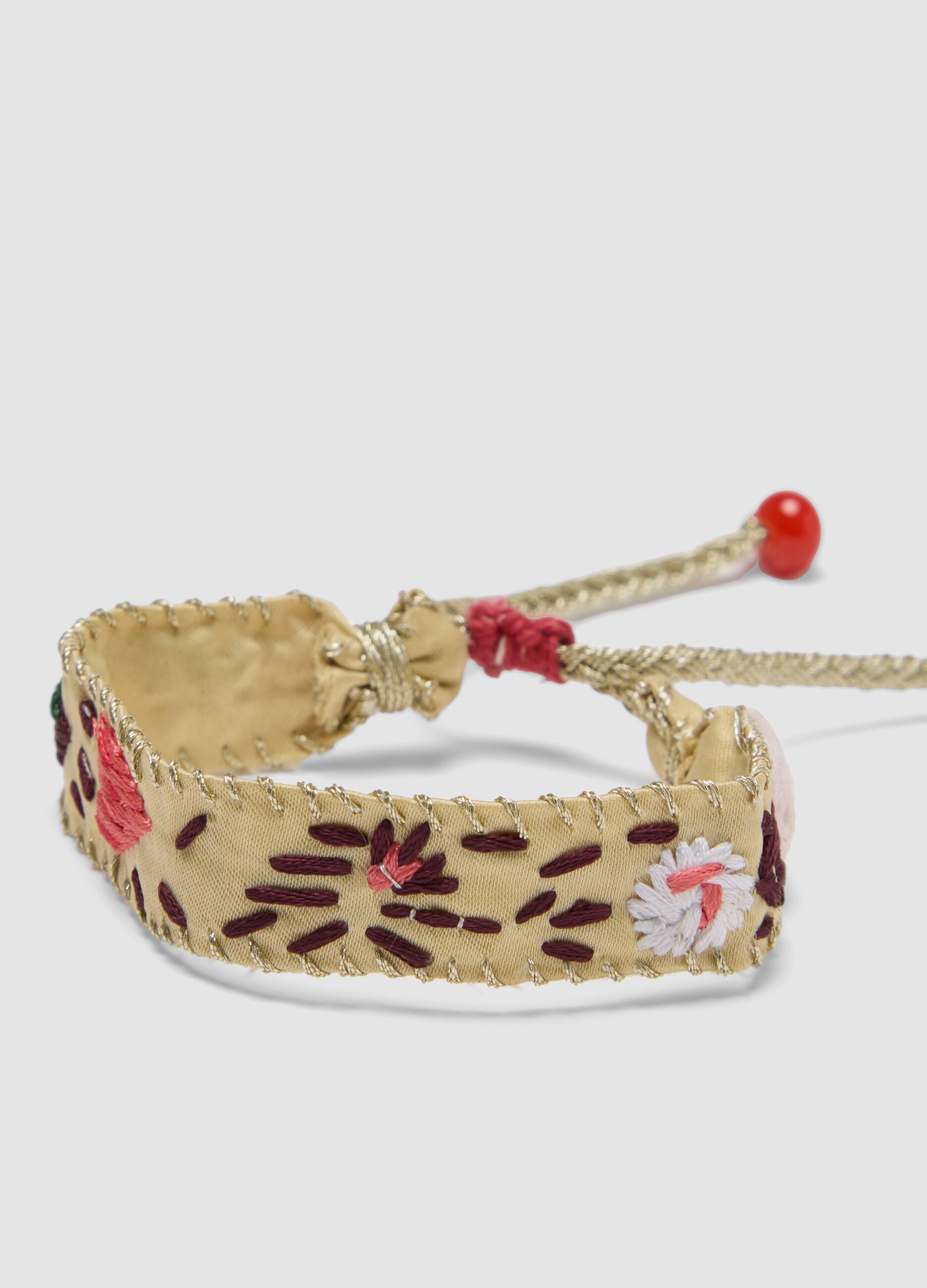 Beige besticktes Armband mit verstellbaren Bindeb&auml;ndern