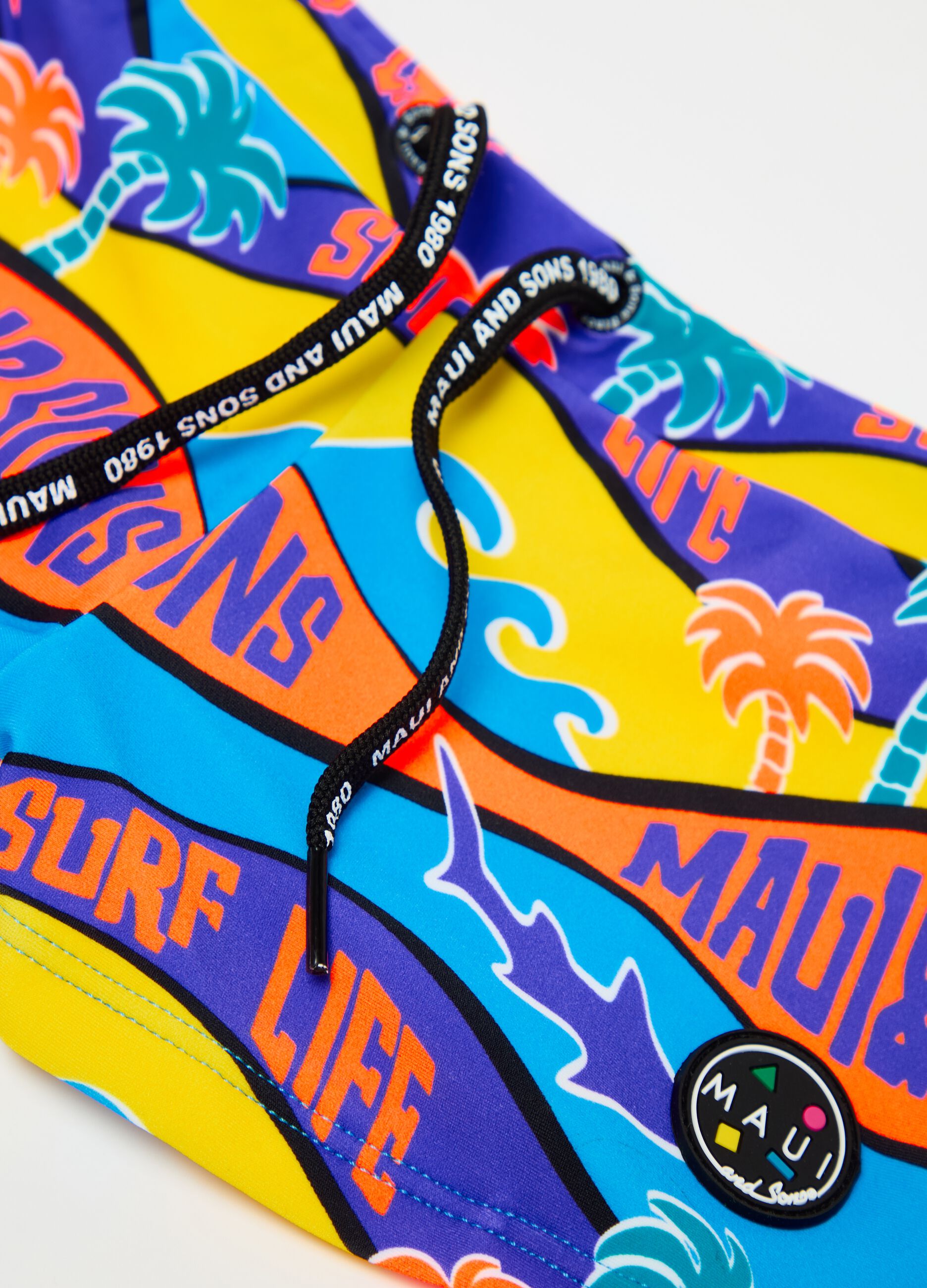 Swimming trunks with multicoloured surf print