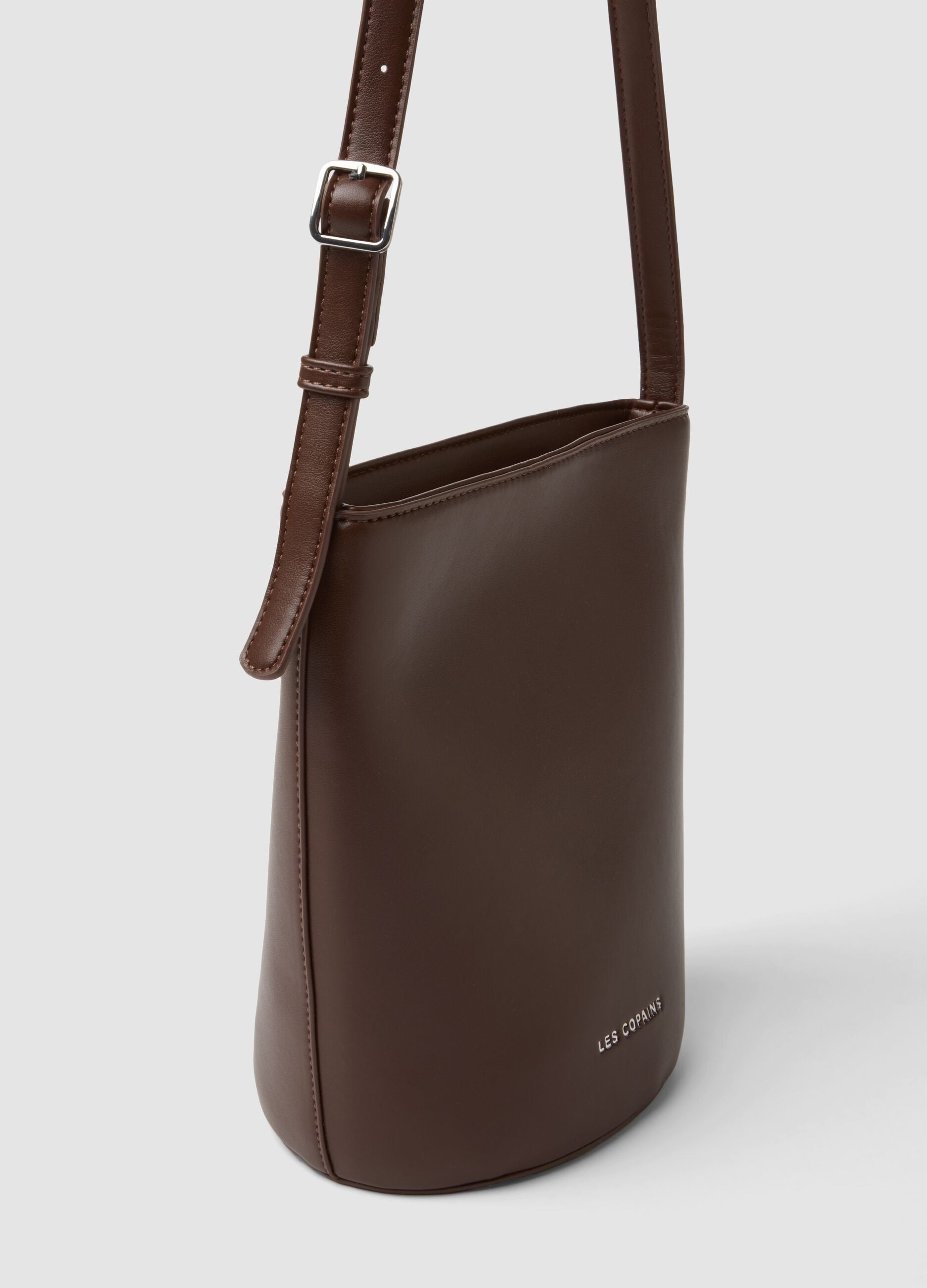 Brown bucket bag with adjustable shoulder strap