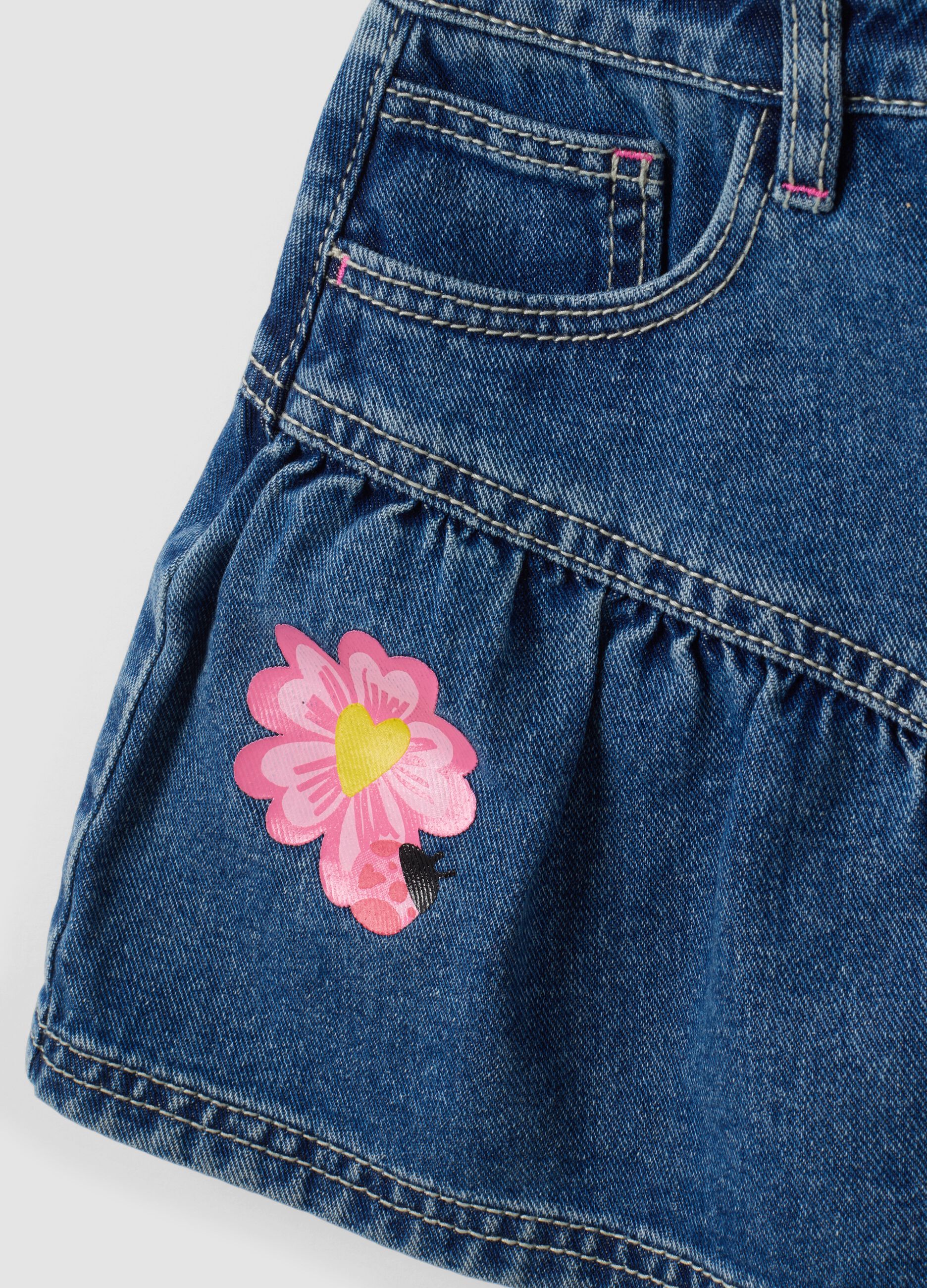 Gonna denim blu in puro cotone con ricami floreali per bambina