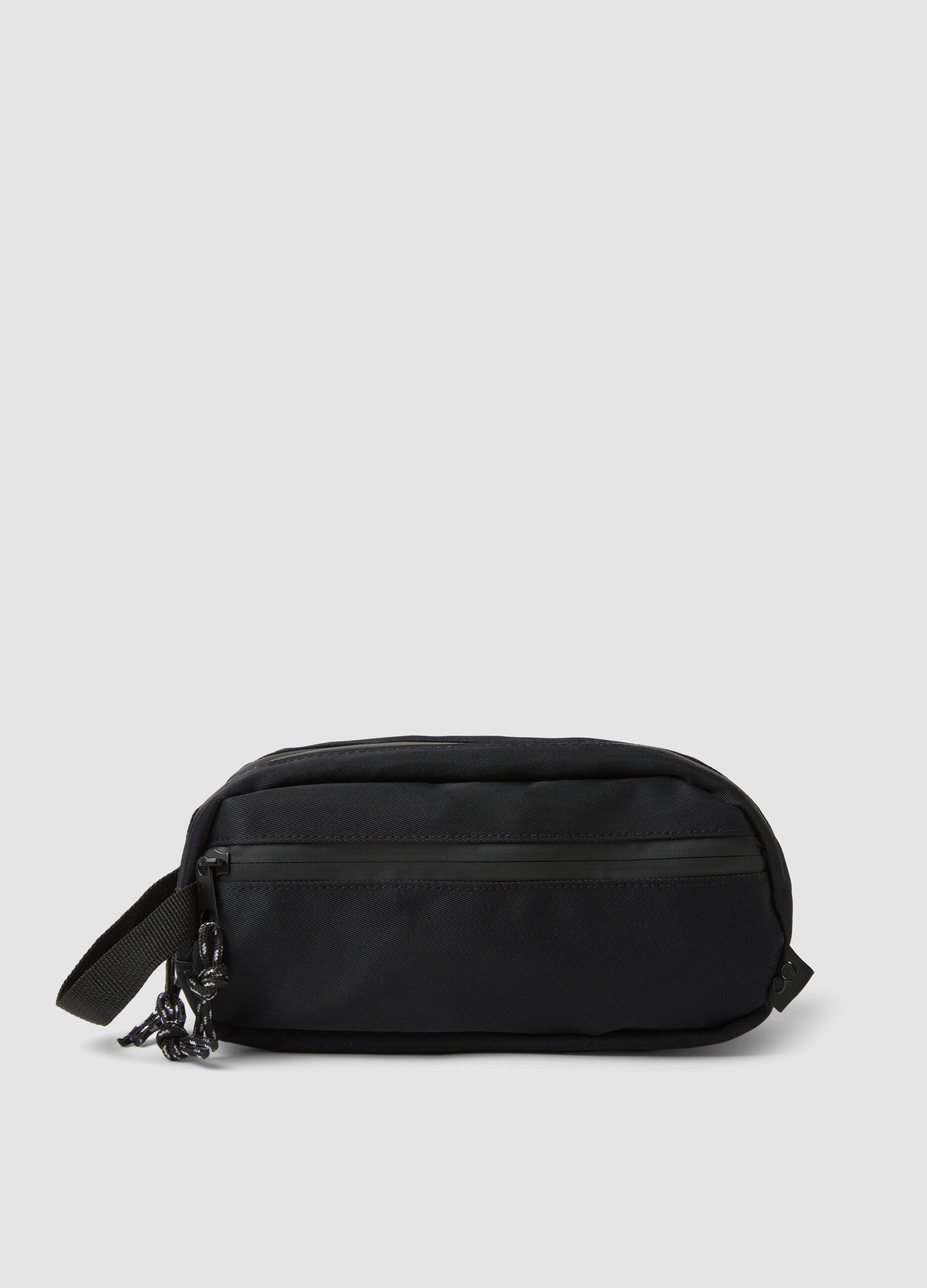 Black toiletry bag with front pocket and zip