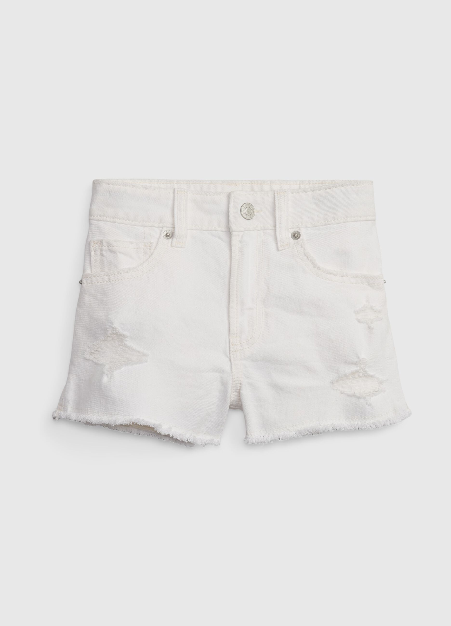 High-rise shorts in denim with worn look