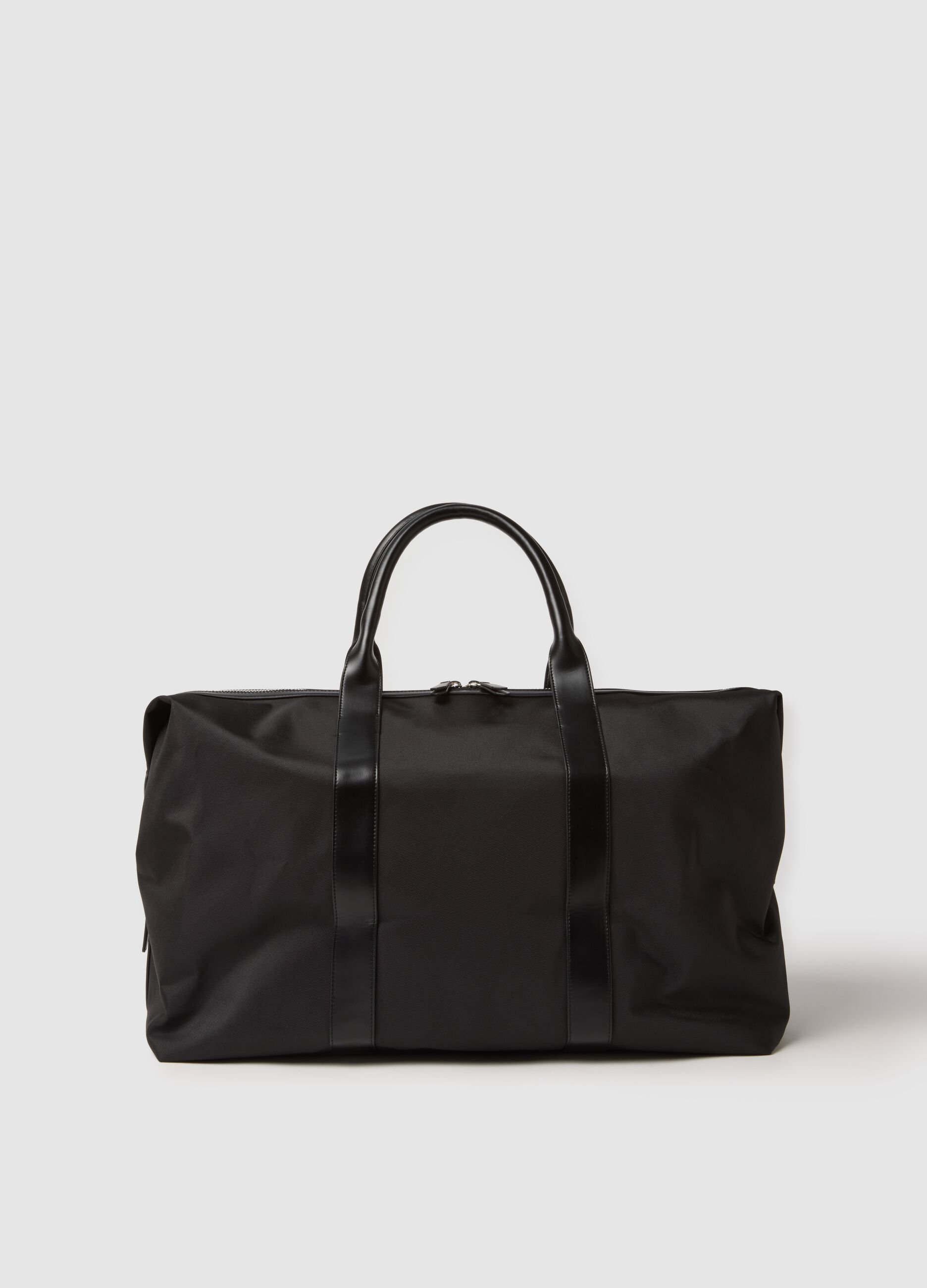Black travel bag with strong handles and zip closure