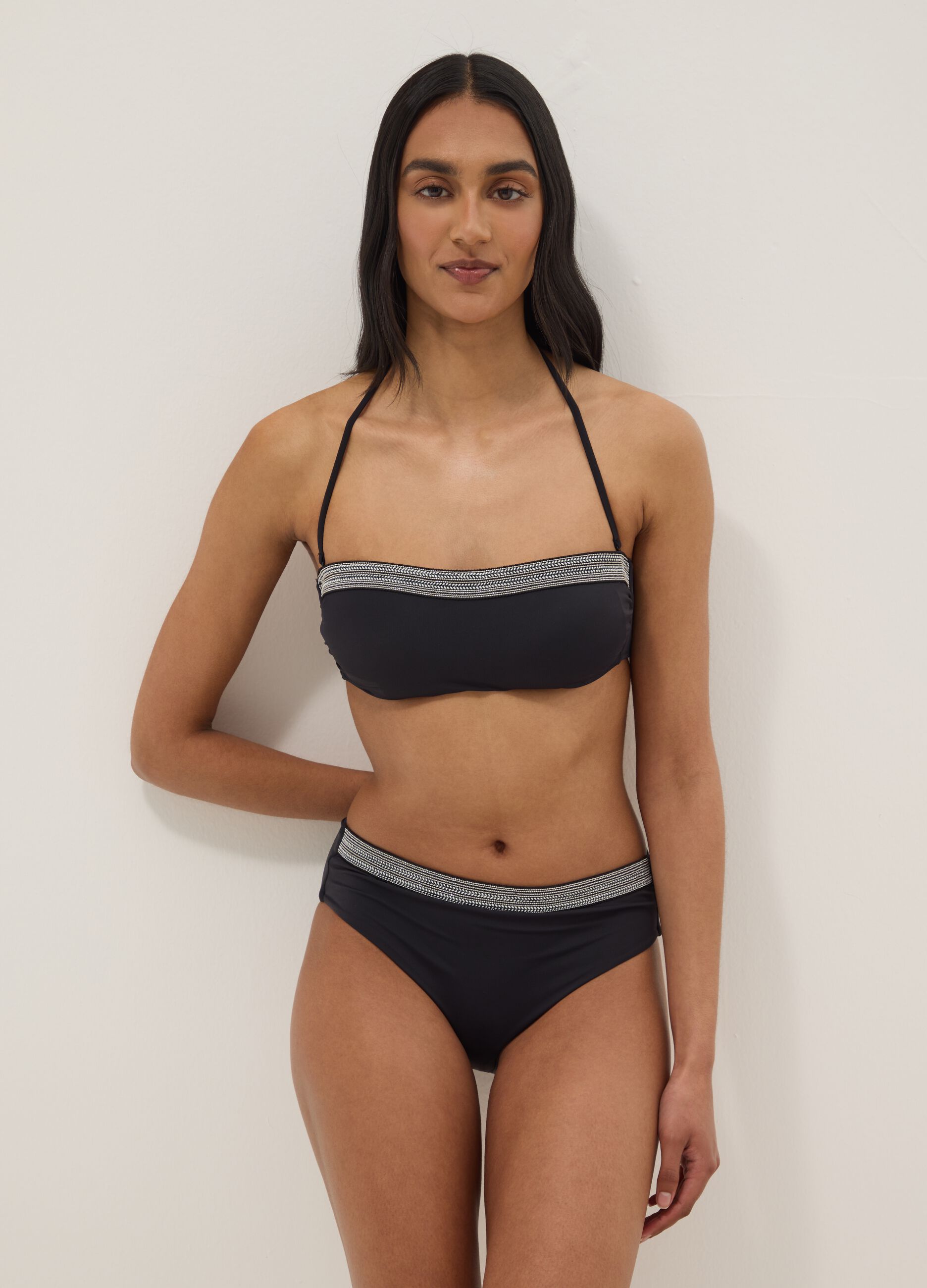 Black stretch swim briefs with embroidered details