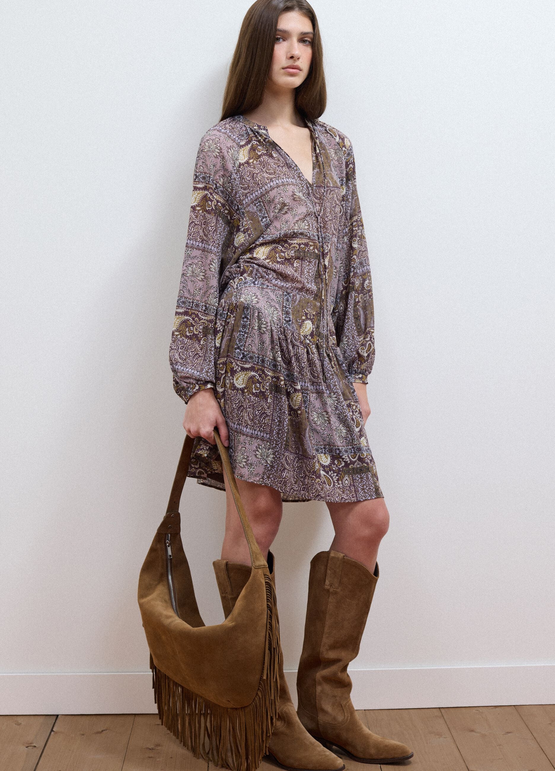 Purple dress with plunging V-neckline and elegant hem ruffle