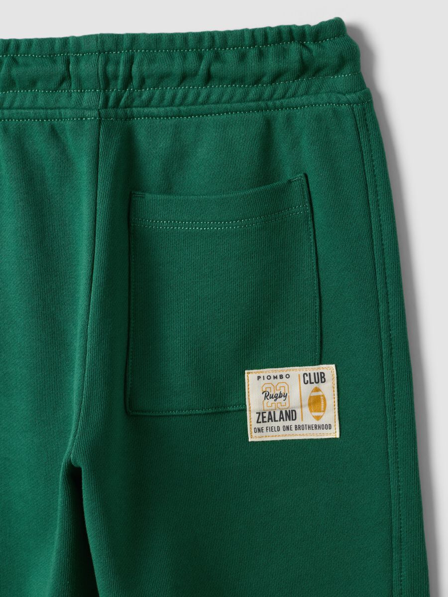Green pure cotton jogger trousers with elasticated waist for boys_3