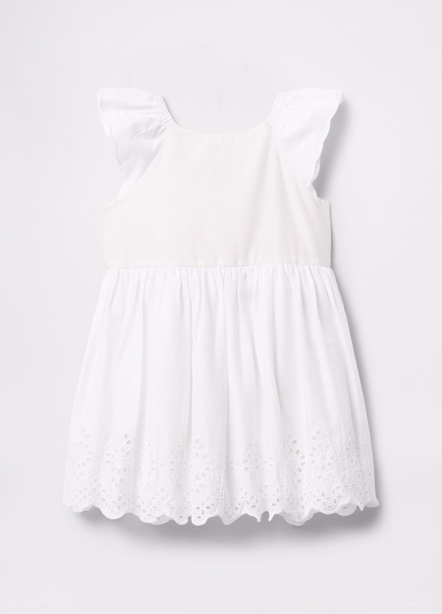 White dress in cotton with openwork flowers