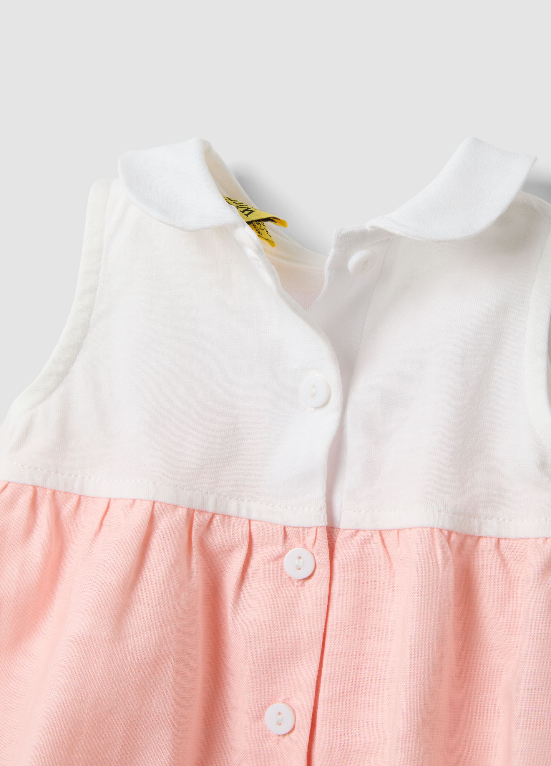 Pink and white organic cotton romper with classic collar