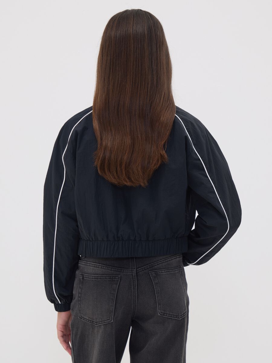 Black zip-up jacket with contrasting piping and high neck for girls_2