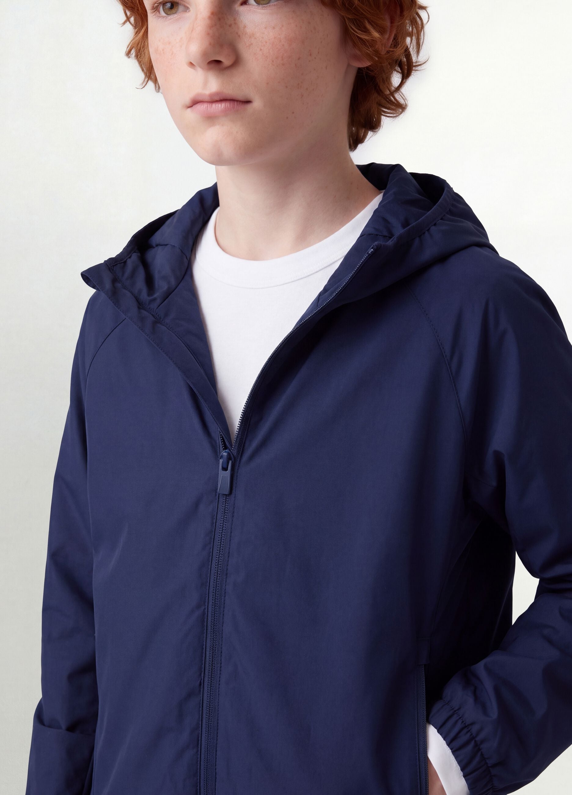 Blue boys&rsquo; rain jacket with hood and zip