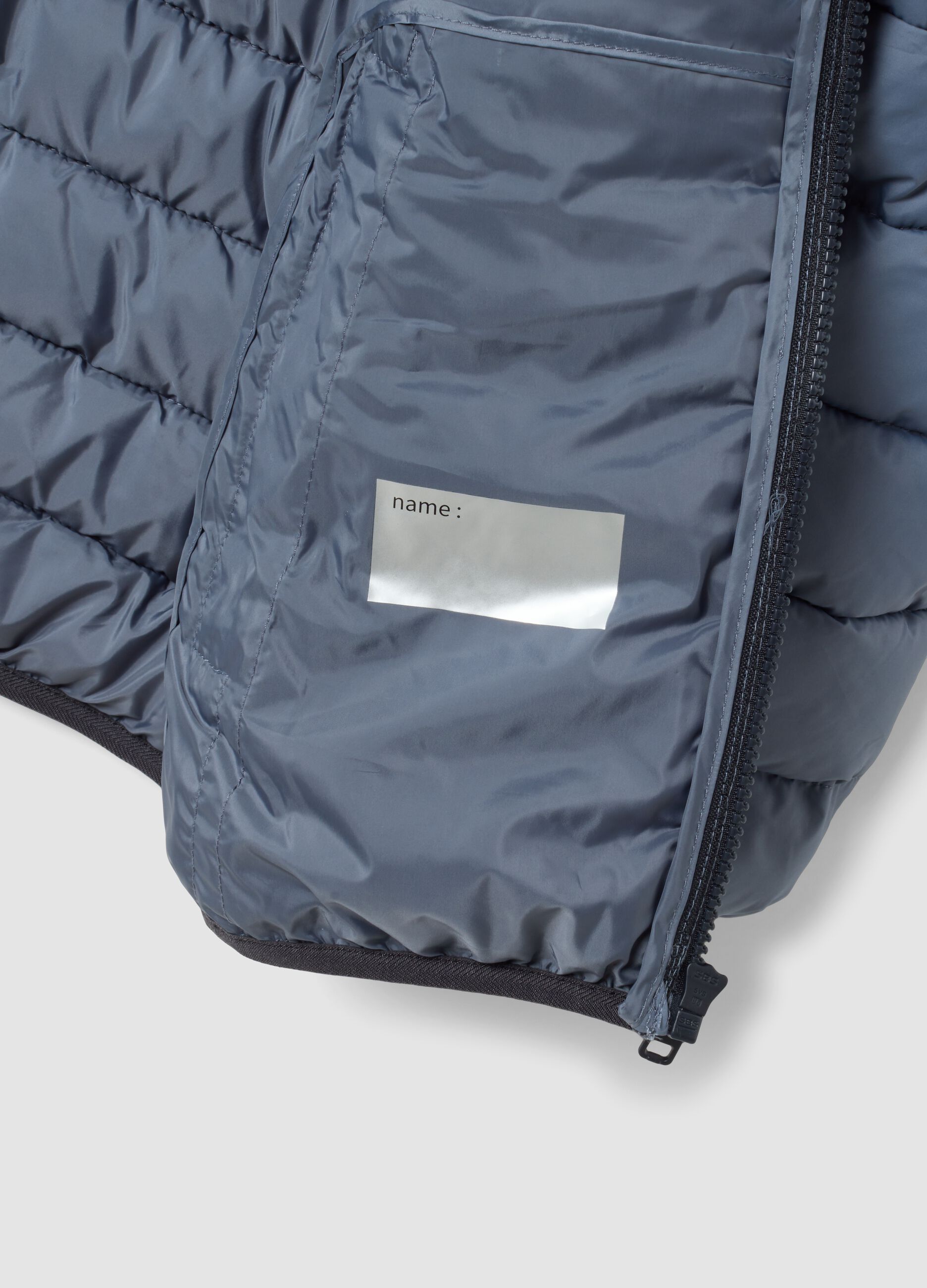 Giubbotto Ultralight grigio imbottito con cappuccio e zip per ragazzo