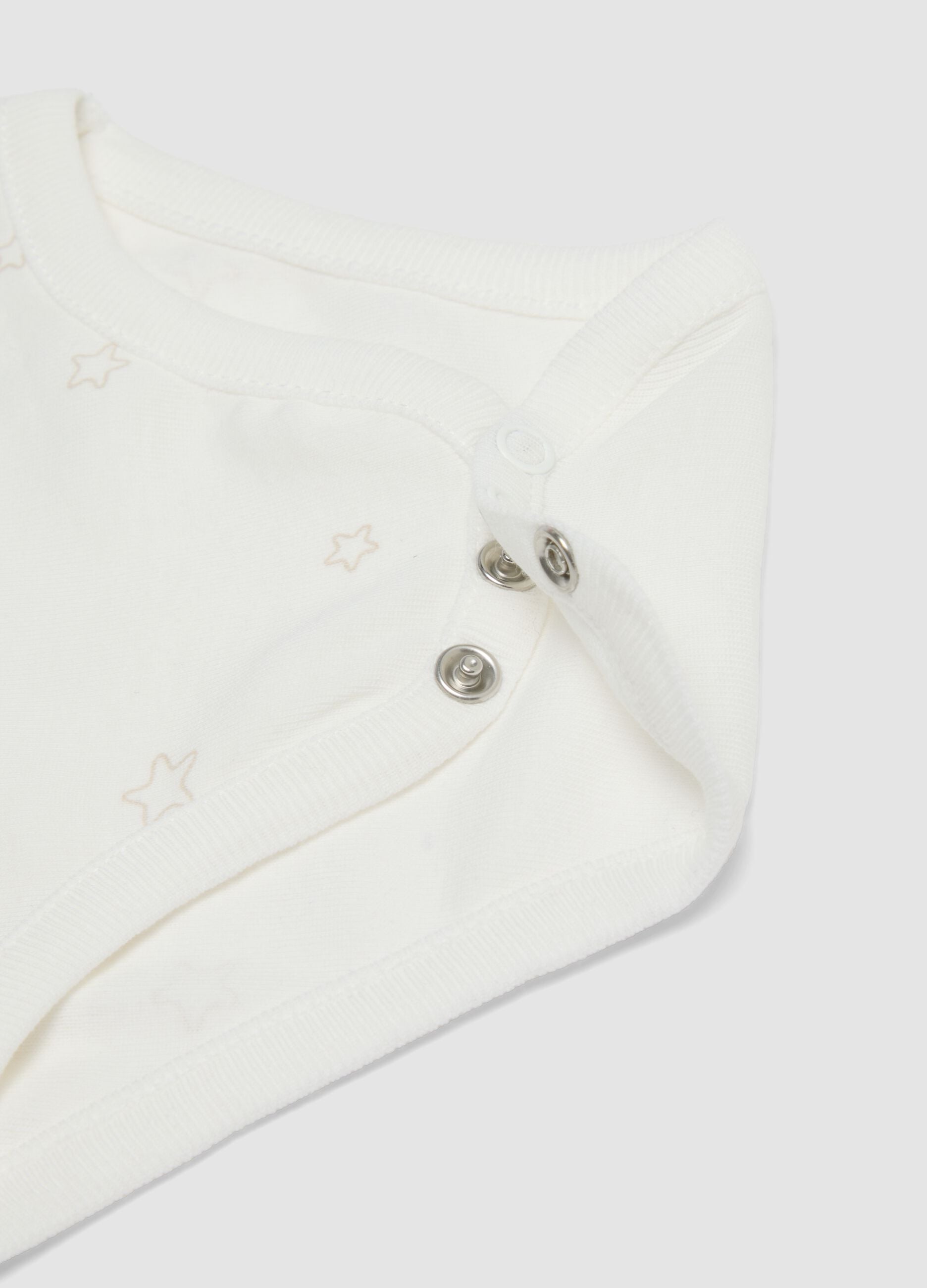 Two-pack of white organic cotton bodysuits with prints
